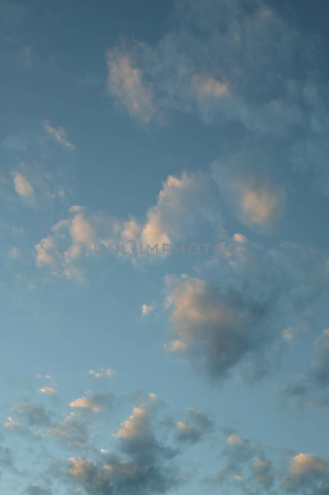 A blue cloudy sky photographed at sunset