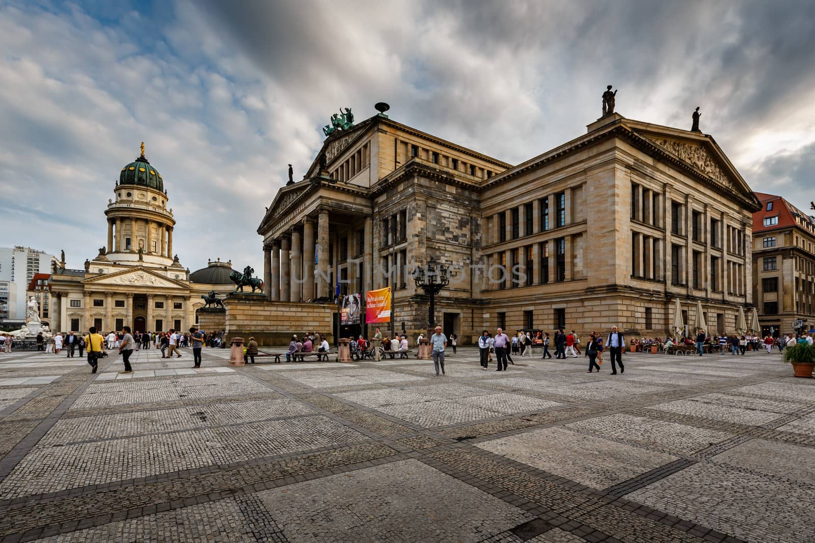 BERLIN, GERMANY - AUGUST 10: German Cathedral and Gendarmenmarkt Square on August 10, 2013 in Berlin, Germany. The square was created by Johann Arnold Nering at the end of the seventeenth century.