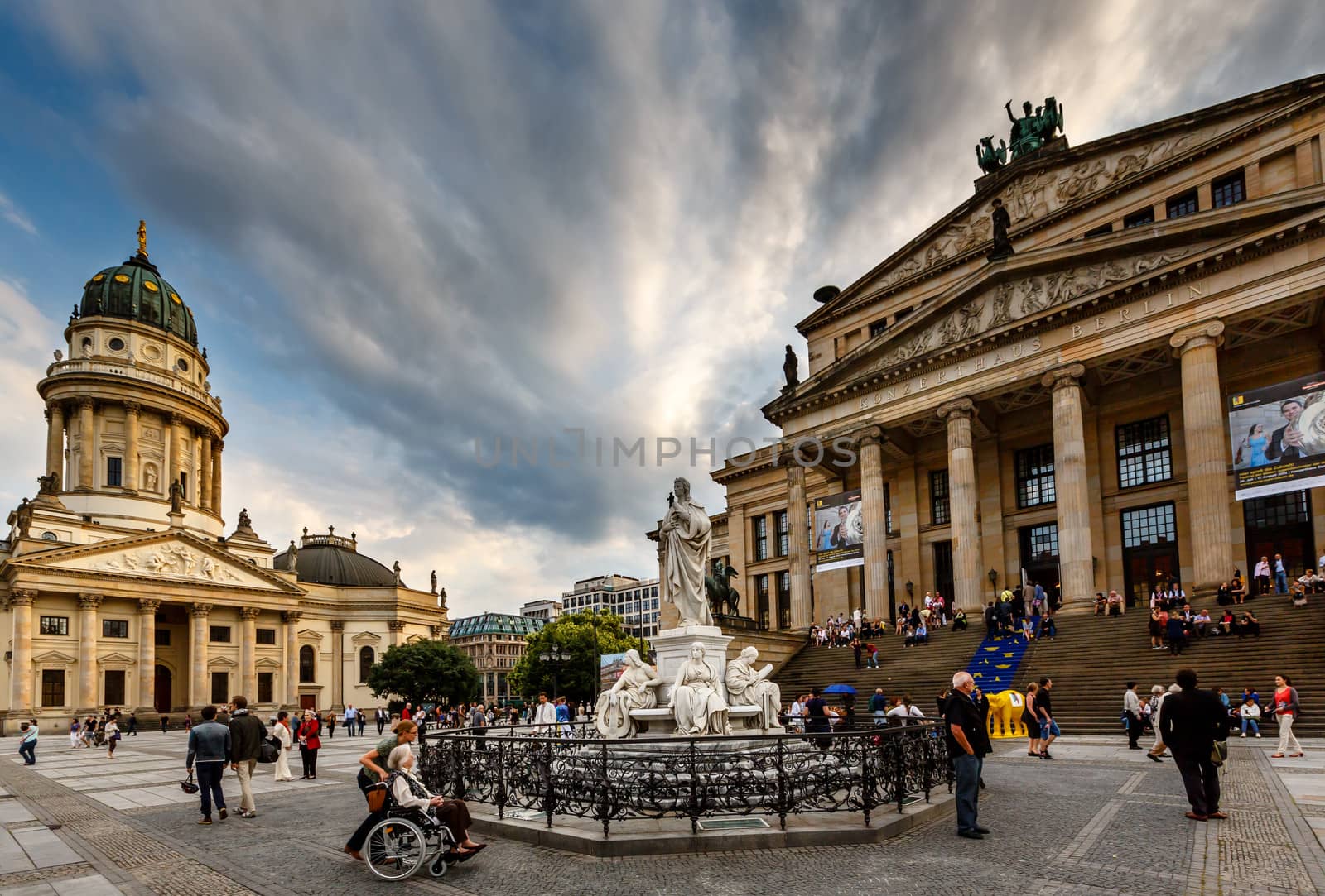 BERLIN, GERMANY - AUGUST 10: German Cathedral and Gendarmenmarkt Square on August 10, 2013 in Berlin, Germany. The square was created by Johann Arnold Nering at the end of the seventeenth century.