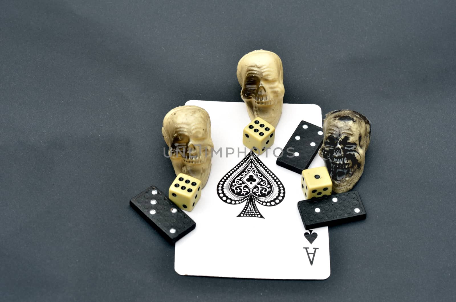 Dice skulls and dominoes on Ace