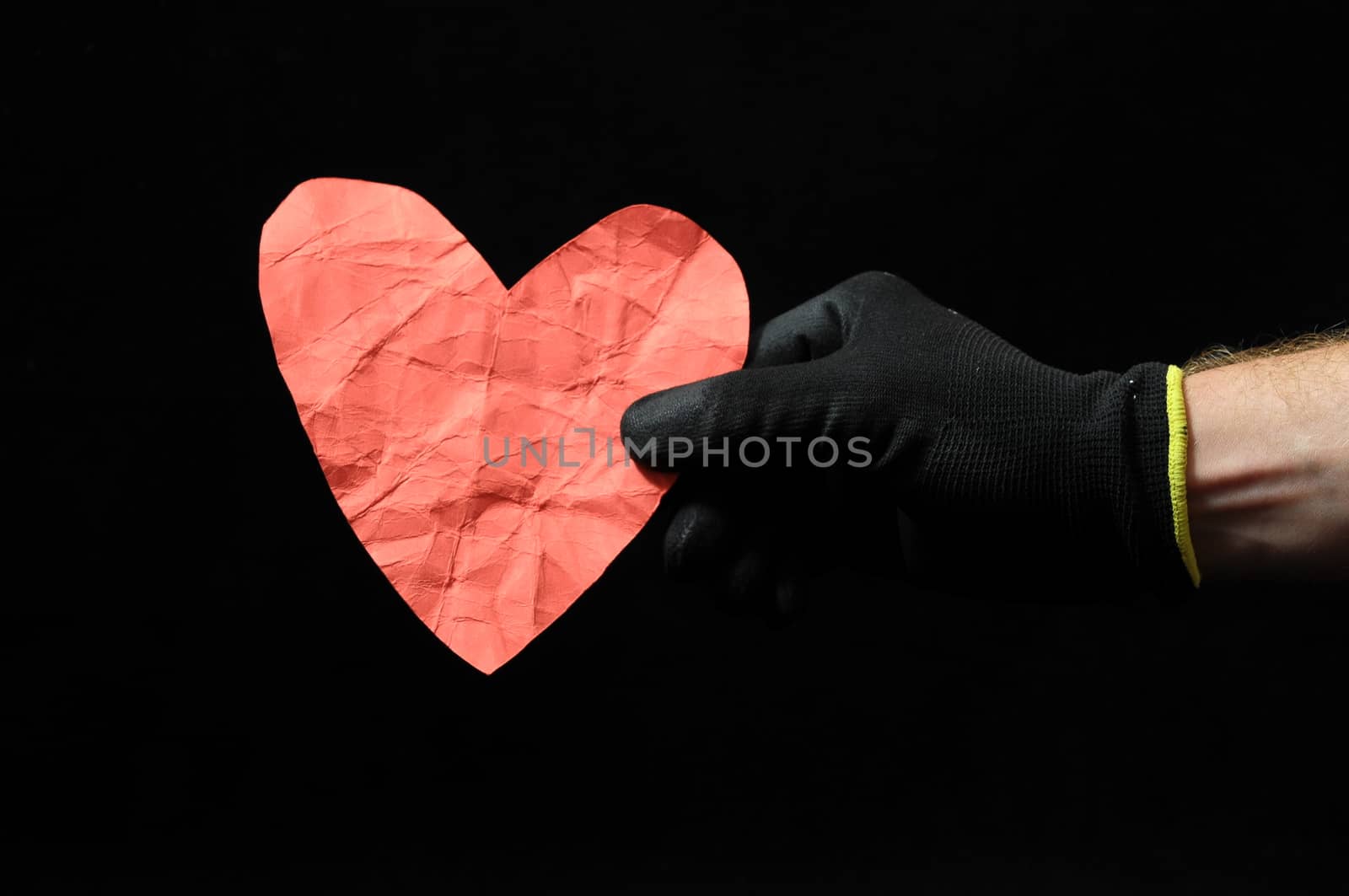 Heart And an Hand on a Black Background