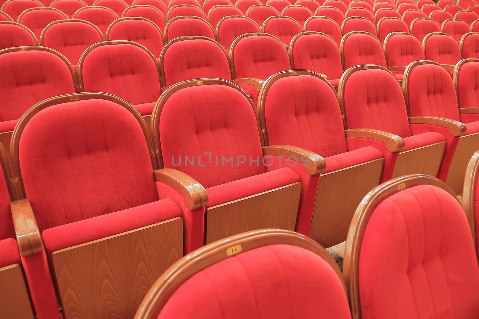 Background of many red theatrical red chairs