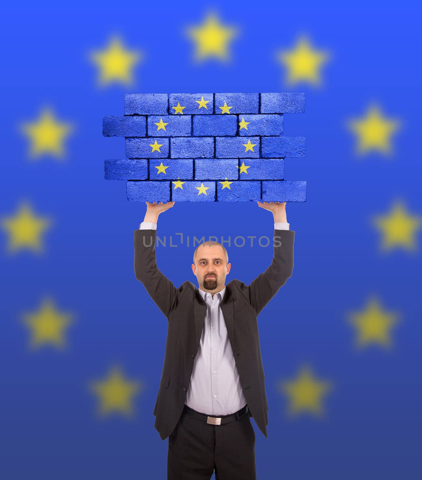 Businessman holding a large piece of a brick wall, flag of the European Union, isolated on national flag