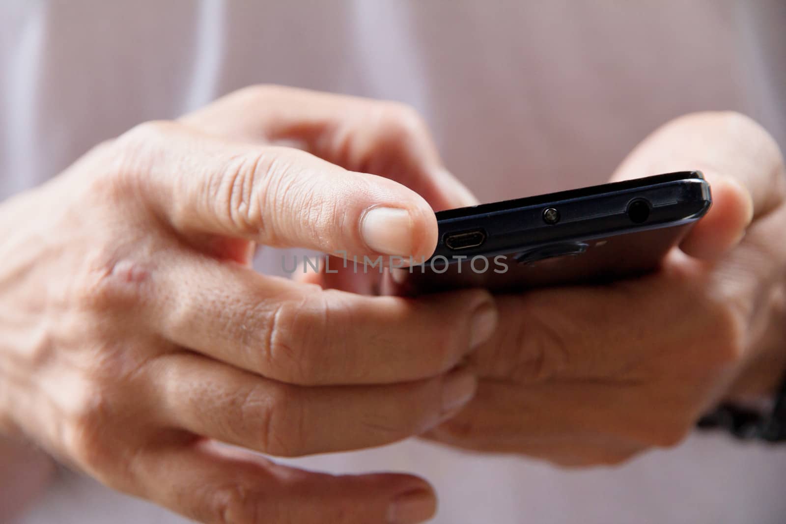 man checking his phone by ponsulak
