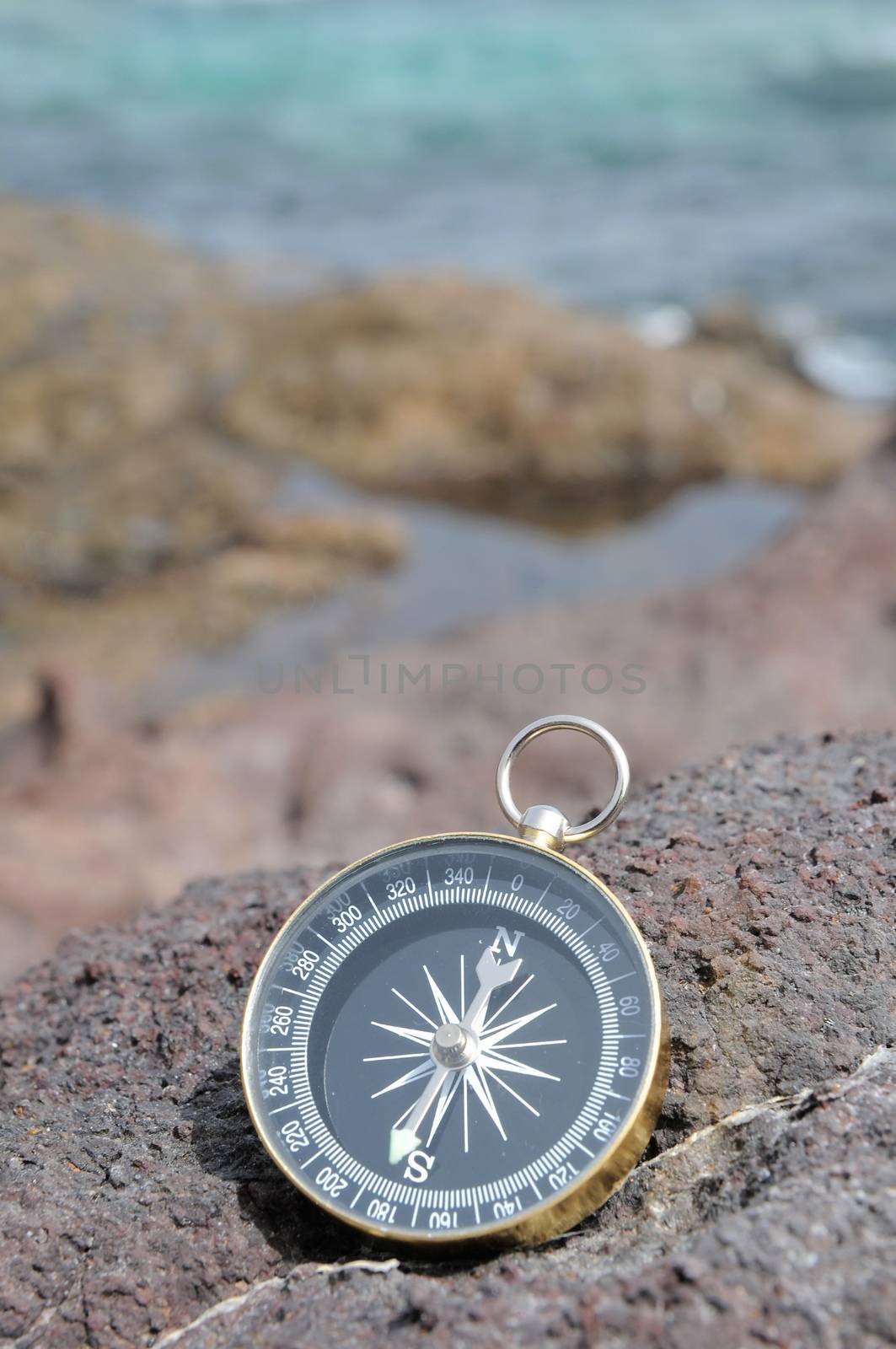 One Compass on the Rocks near the Atlantic Ocean