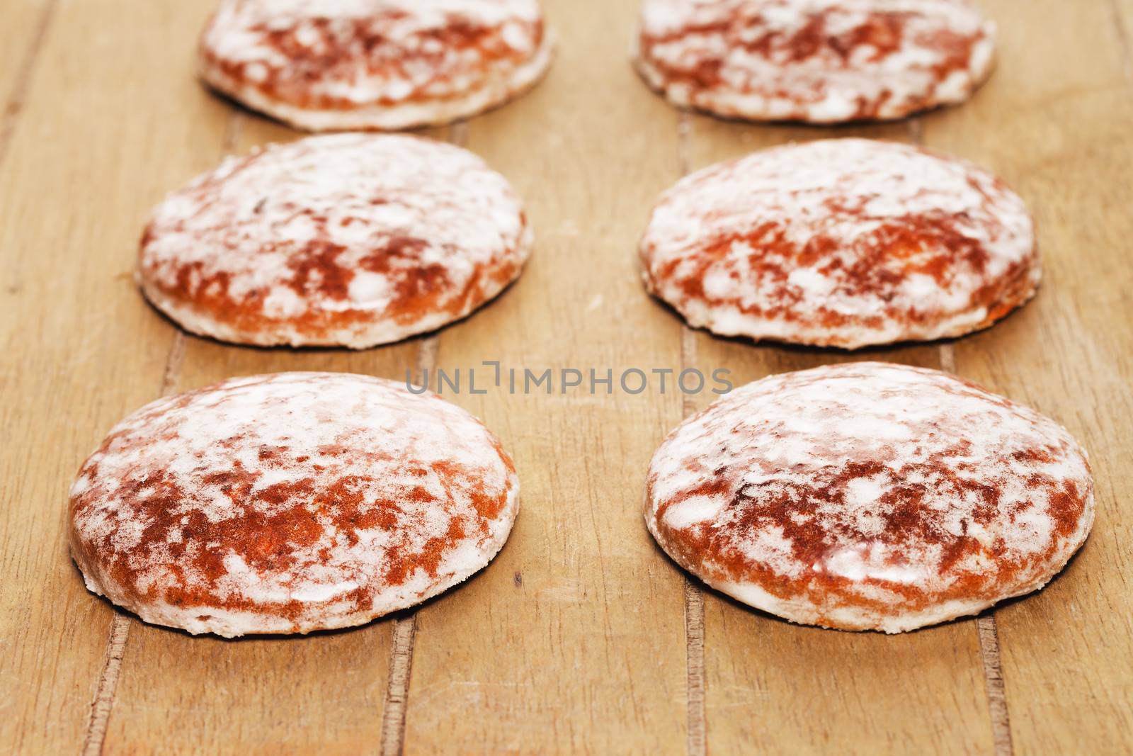 traditional german lebkuchen gingerbread cookies with sugar icing on wooden background