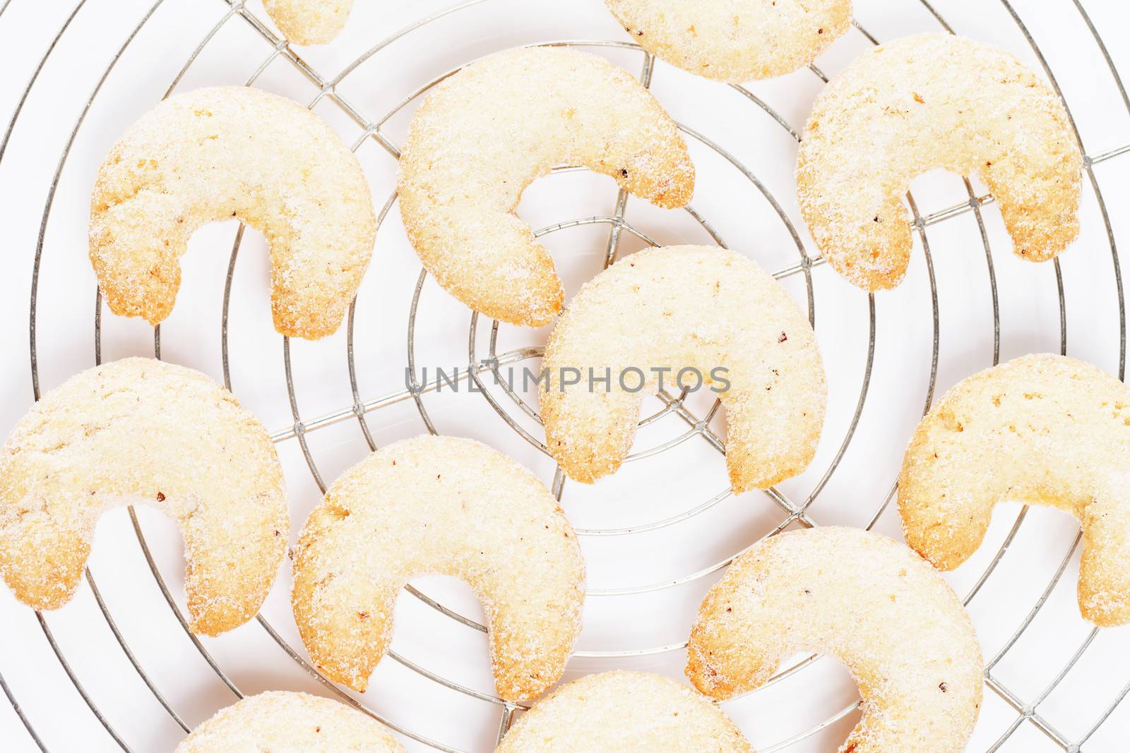 christmas vanilla crescents from top on a cooling grid