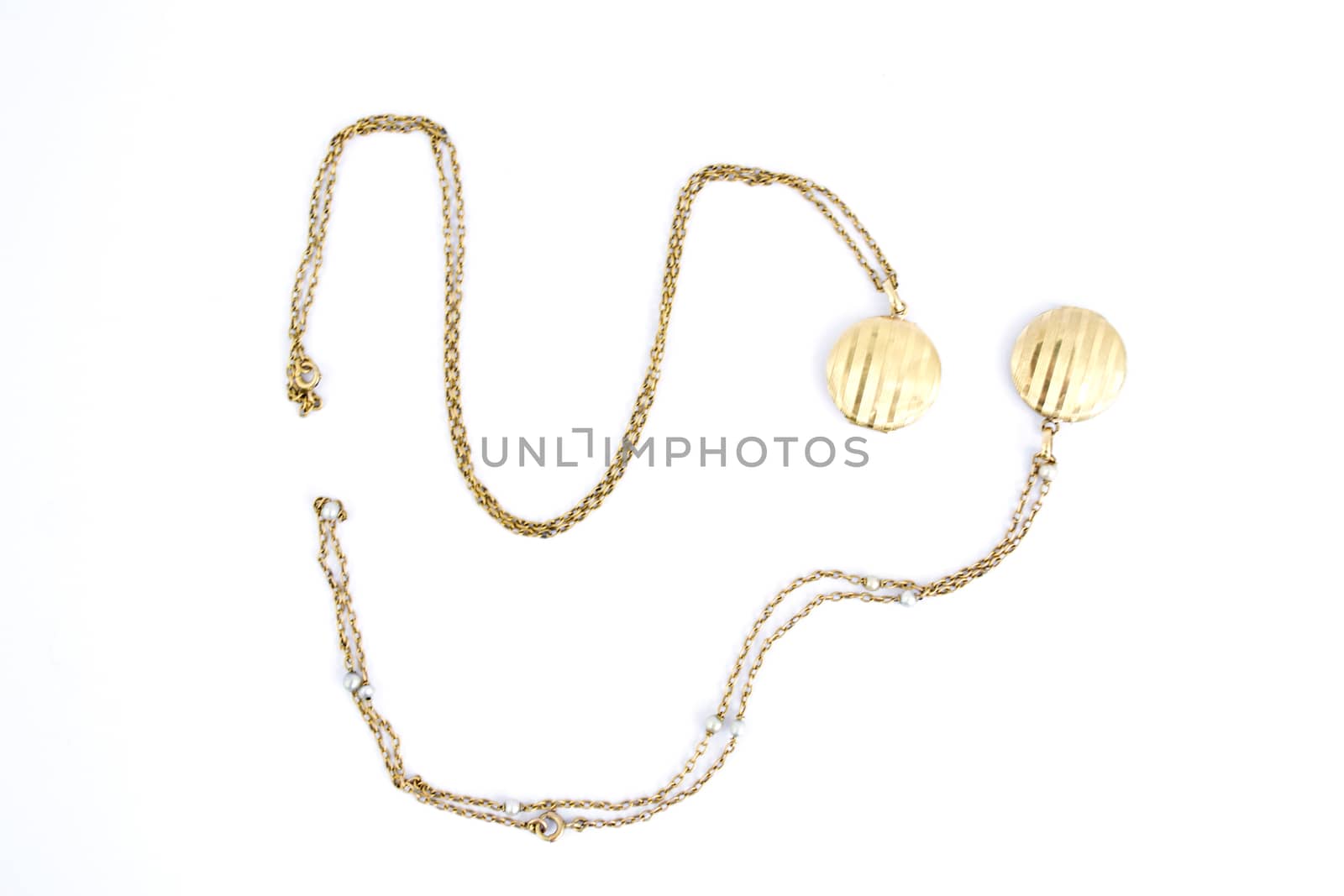 Pair of gold lockets on a white background