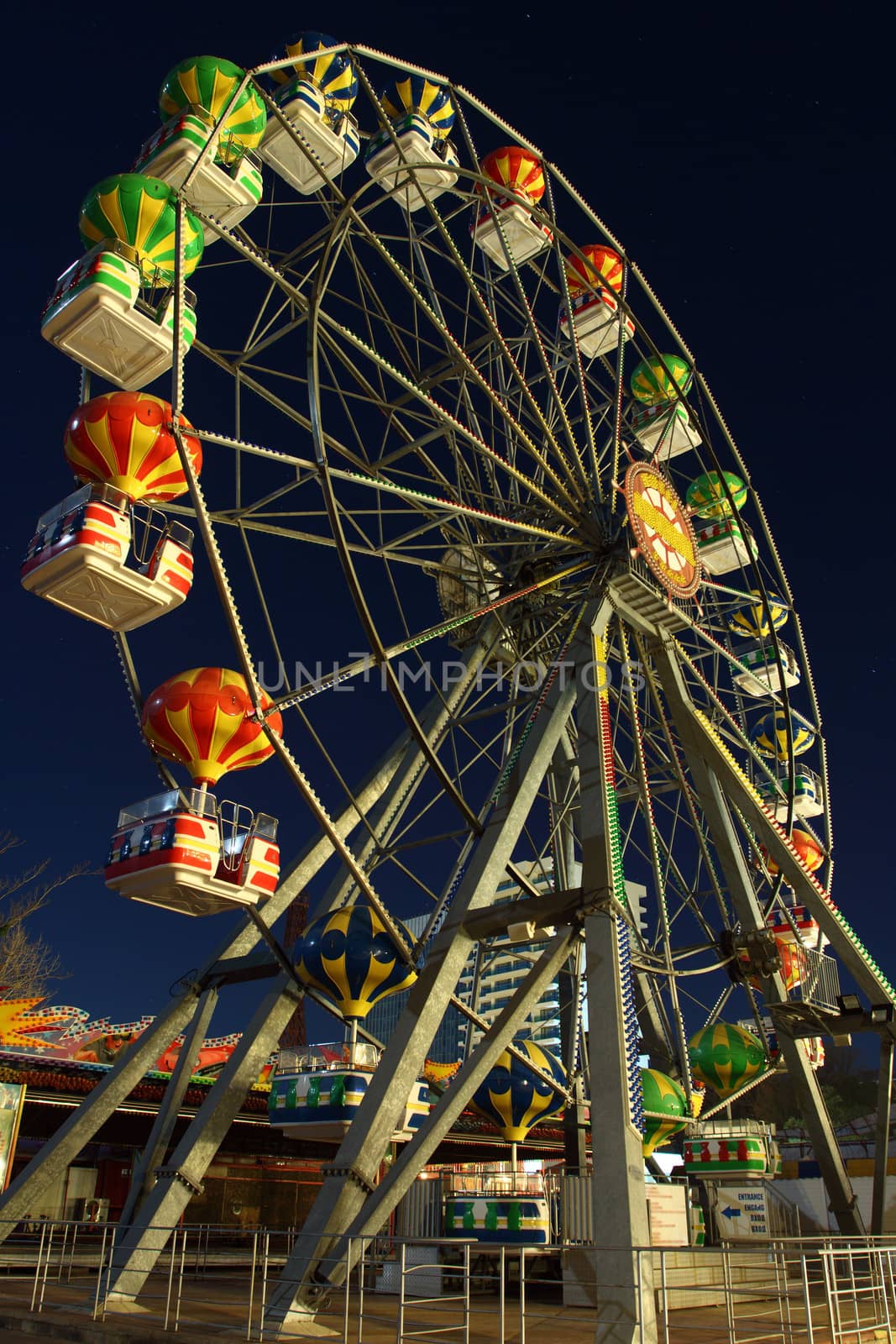 Ferris Wheel at amusement park by night