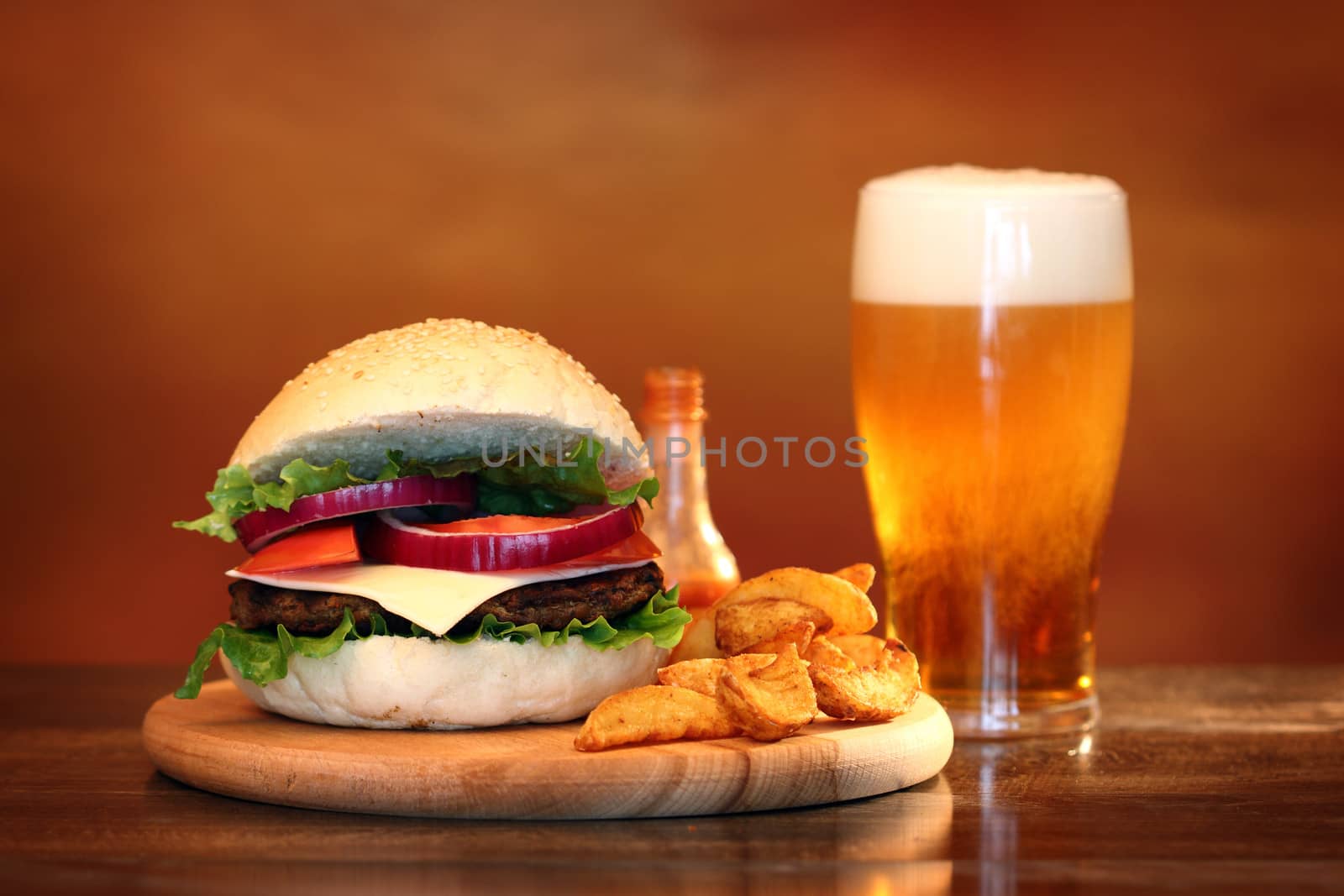 Close up of big tasty burger, french fries and beer