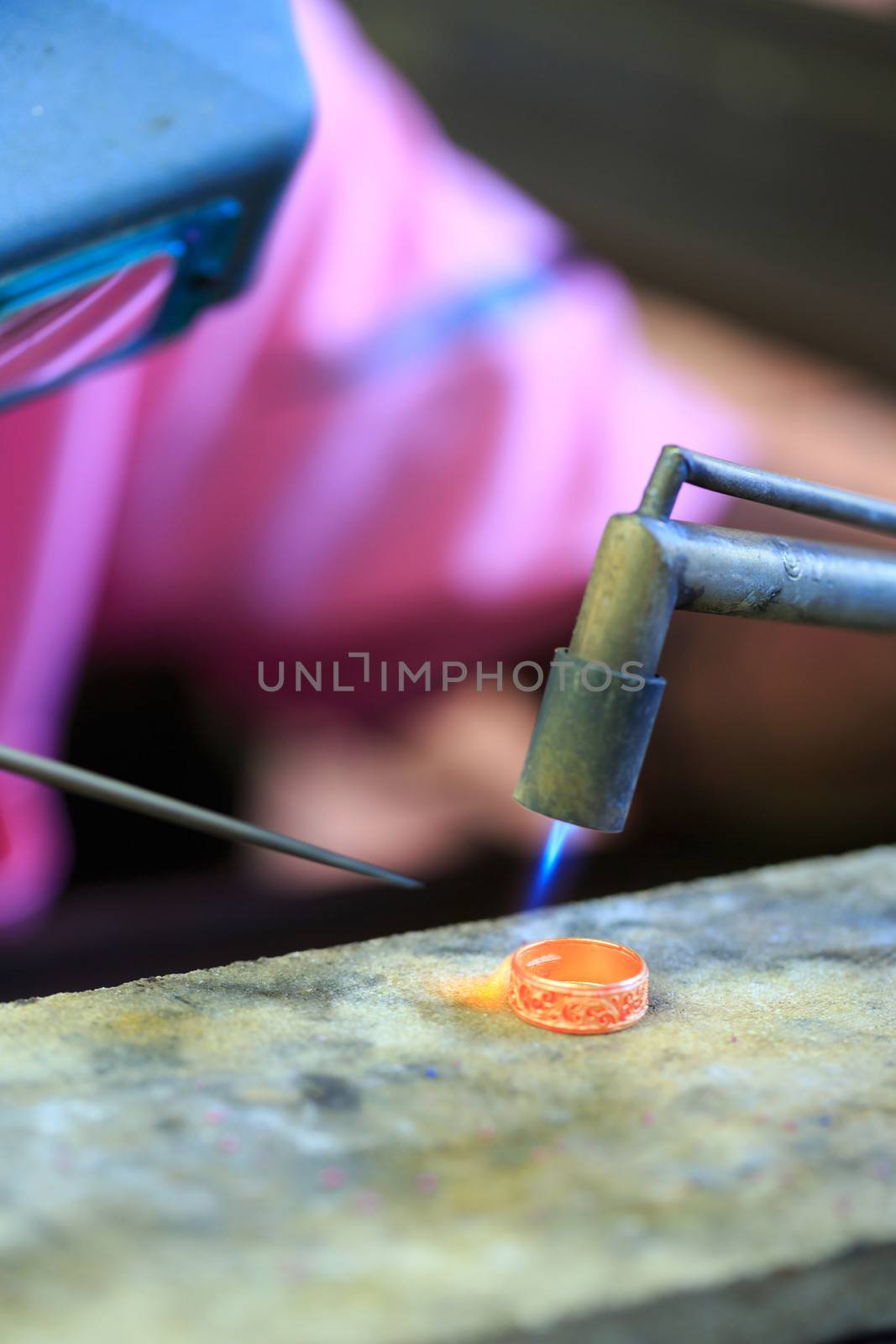 Goldsmith working with a thai traditional ring