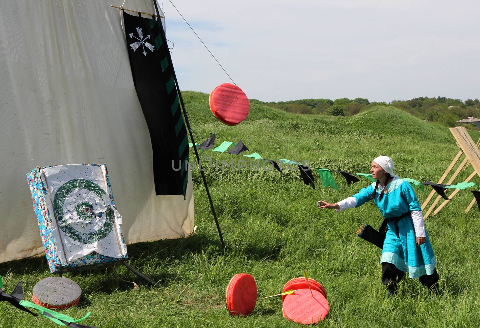 KHOTYN - MAY 10: Archers shooting during Festival Medieval Khotyn on May 10, 2013, Ukraine