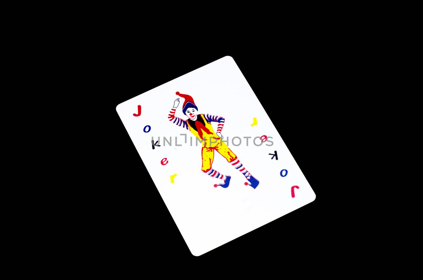 joker card isolated on black background
