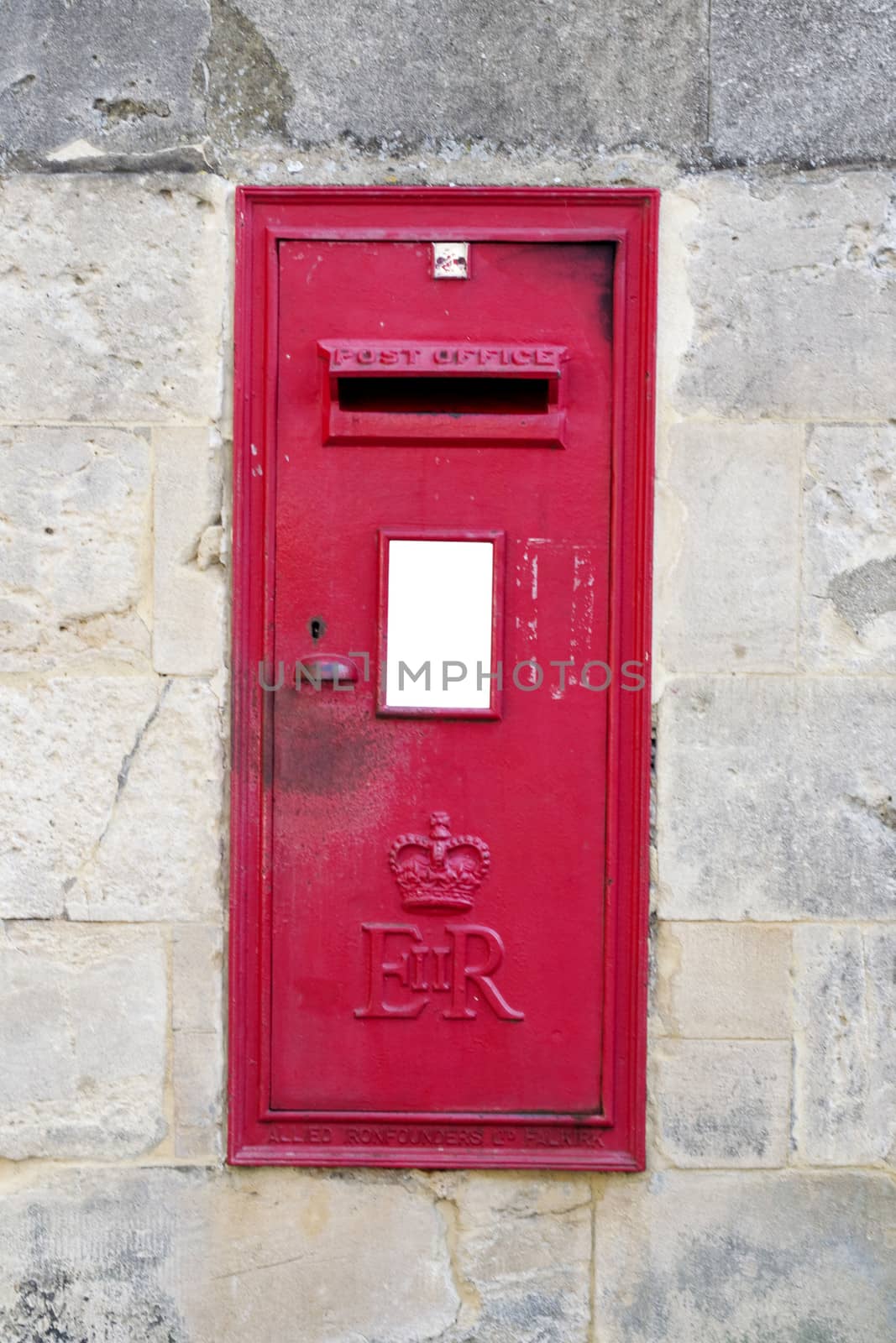 British red post box with a concrete surrounding