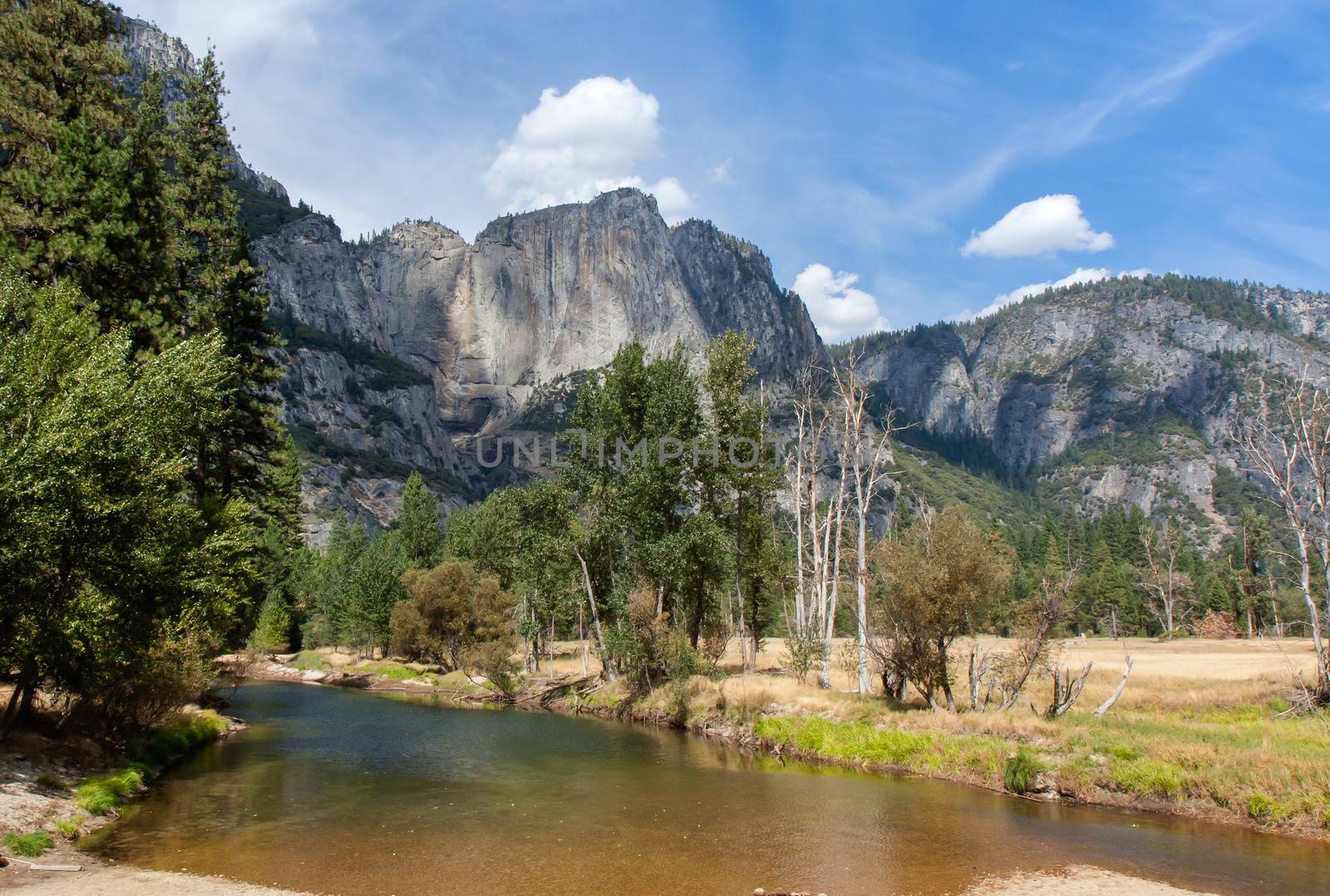 The Merced River threads through Yosemite National Park. This image shows a stretch flowing through Yosemite valley.