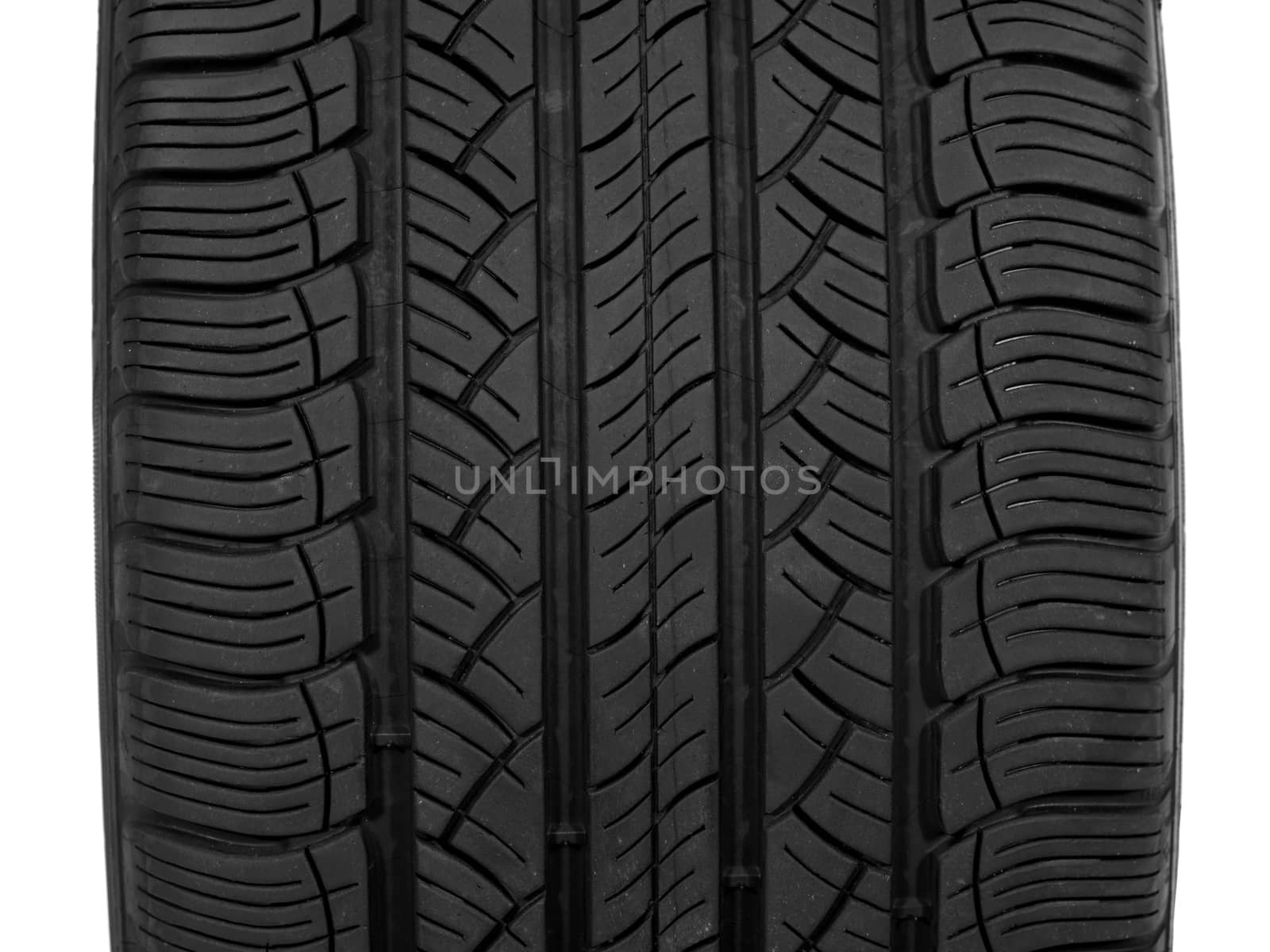 A black rubber tyre isolated against a white background
