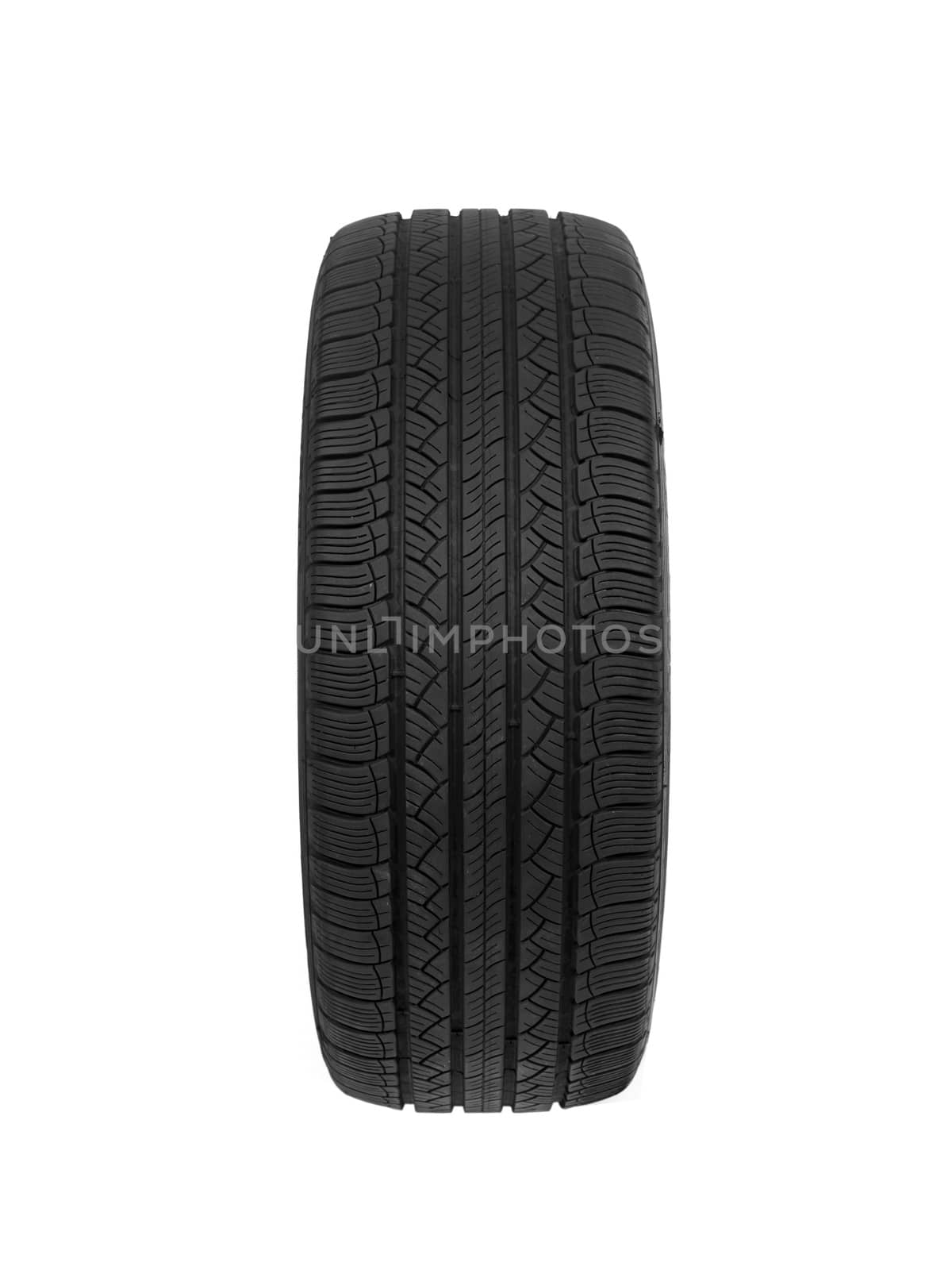 A black rubber tyre isolated against a white background