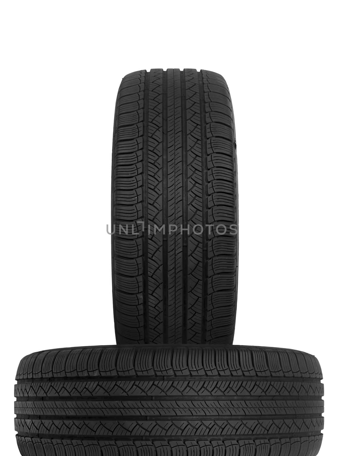 A black rubber tyre isolated against a white background