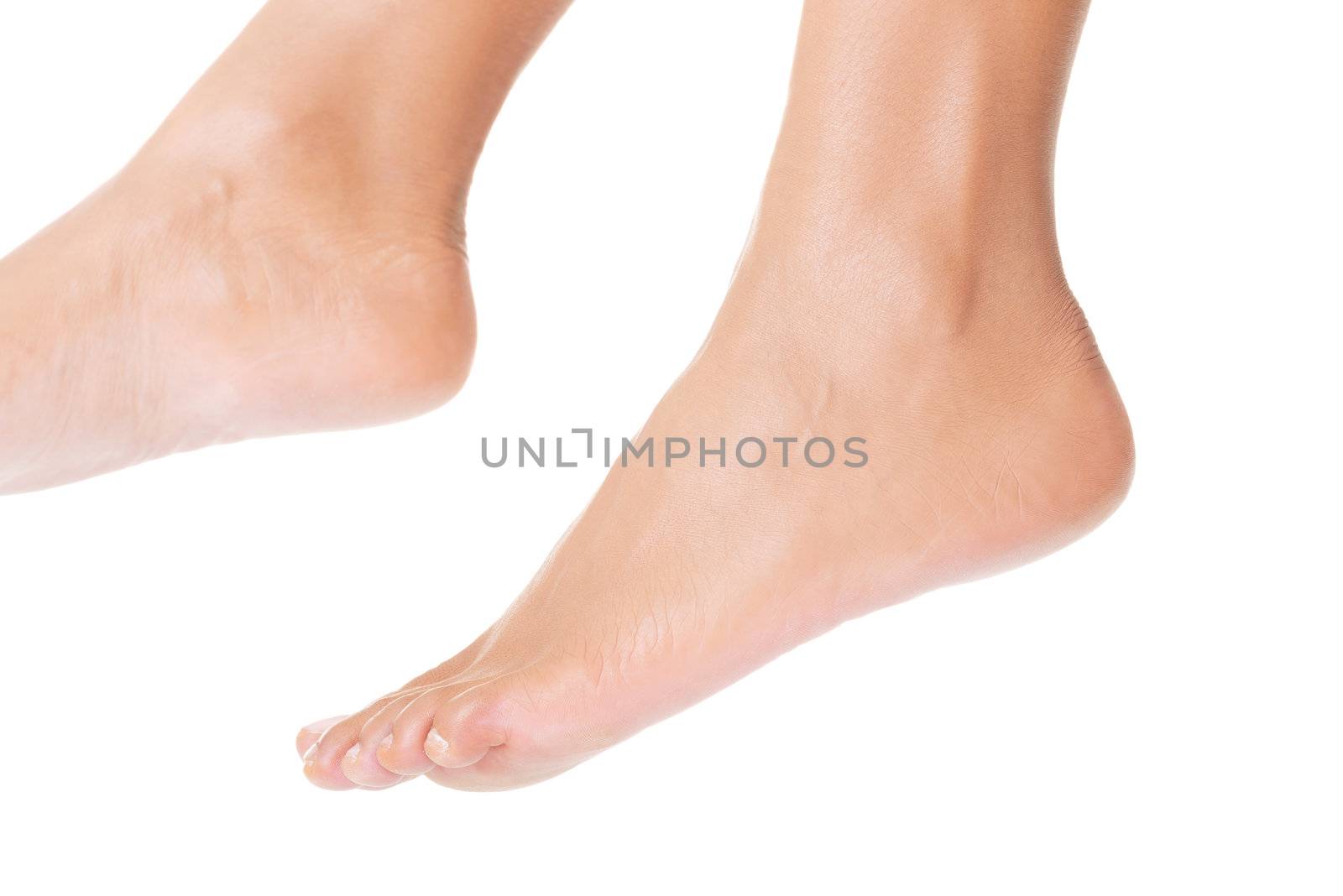 Beautiful caucasian woman feet. Isolated over white background