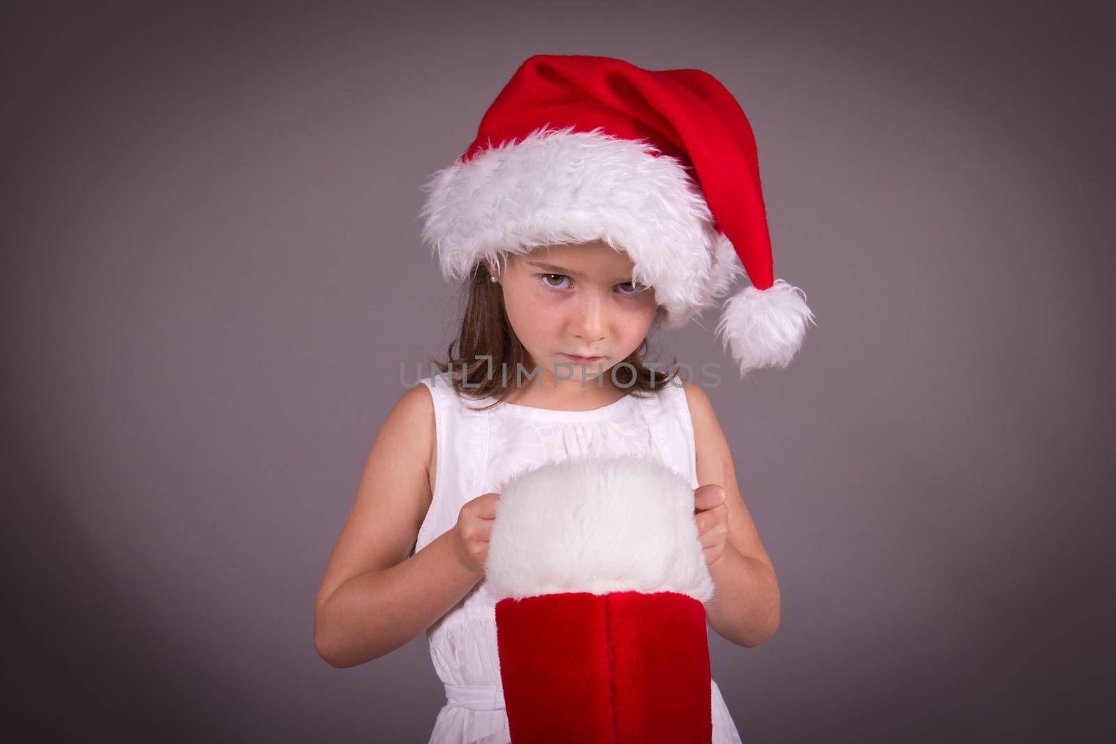 Little girl disapointed with her Christmas stocking