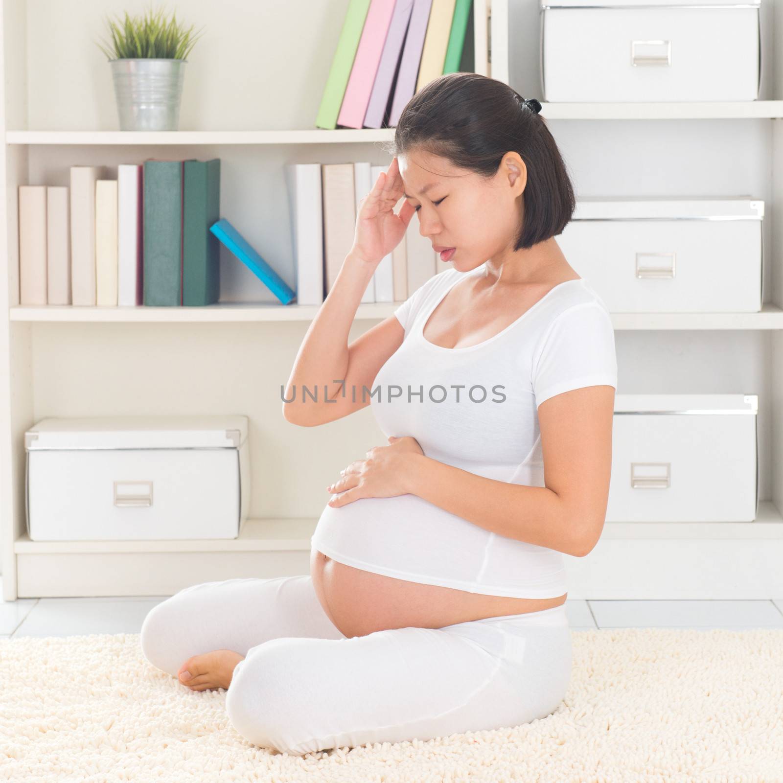 Pregnant woman having headache by szefei