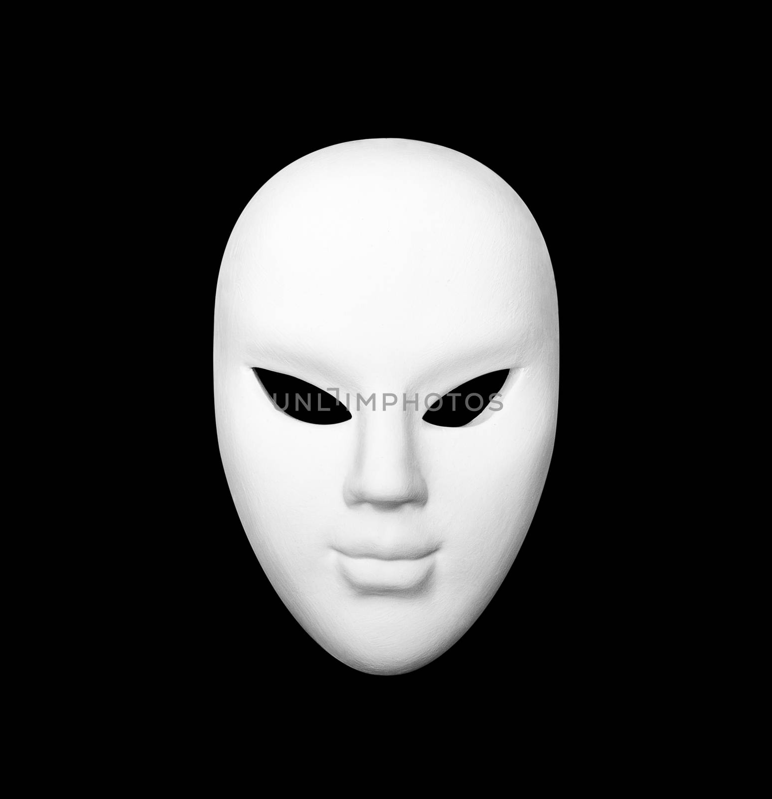 White carnival mask on black isolated background.