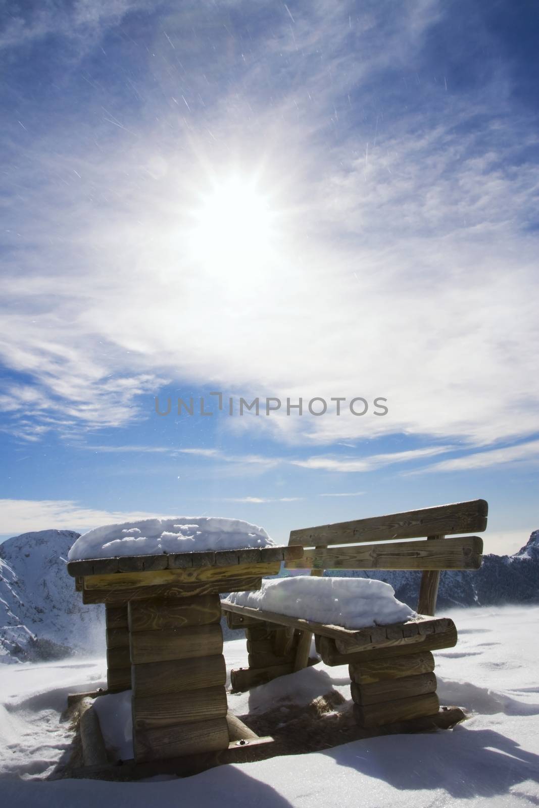 Bench in winter landscape