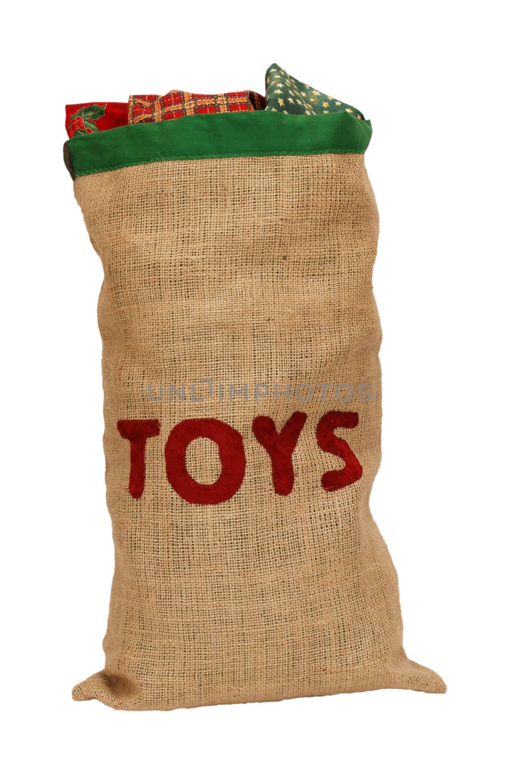 Hessian toy sack stuffed full with Christmas presents, isolated on a white background