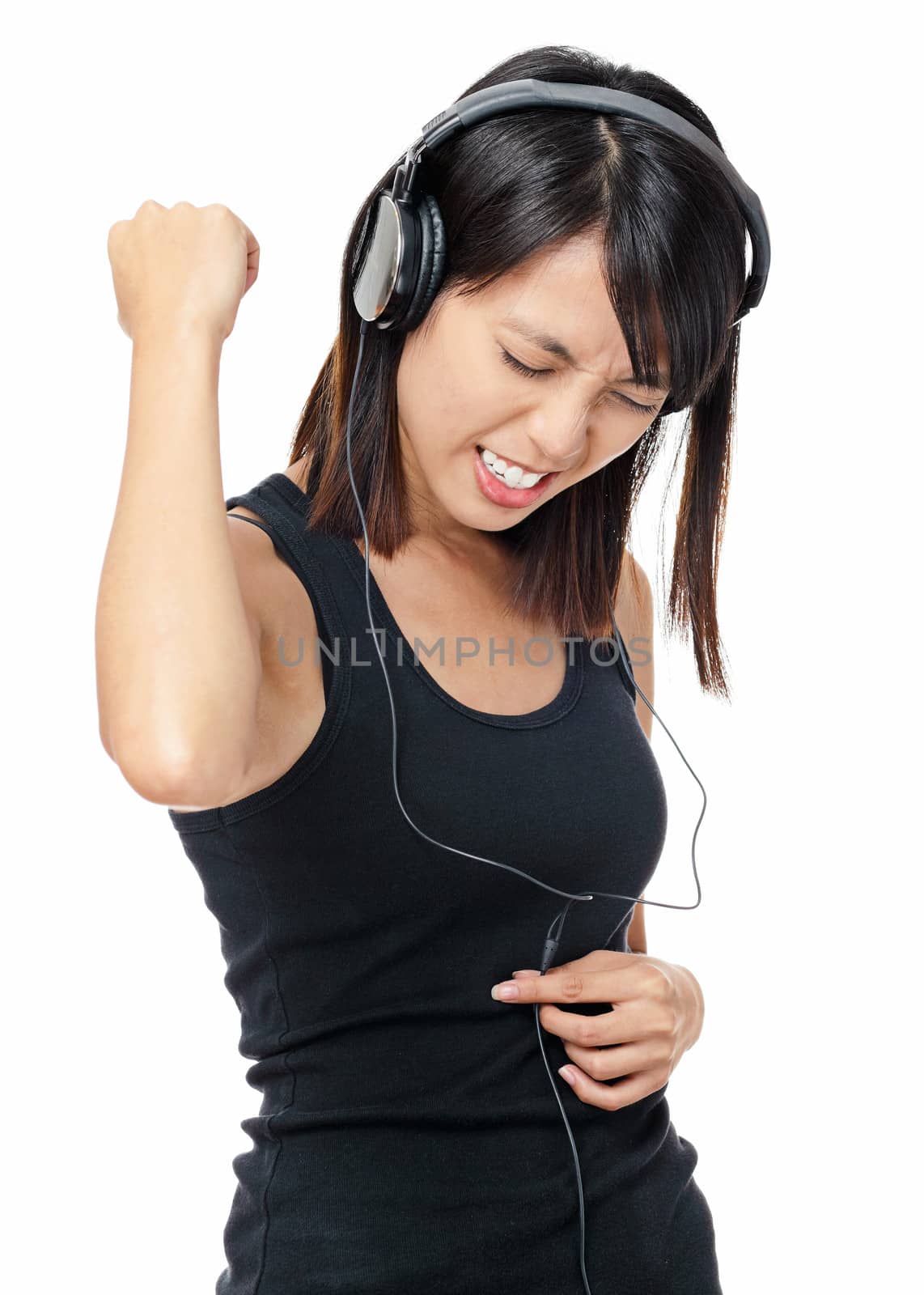 Asian woman listen to rock music by leungchopan