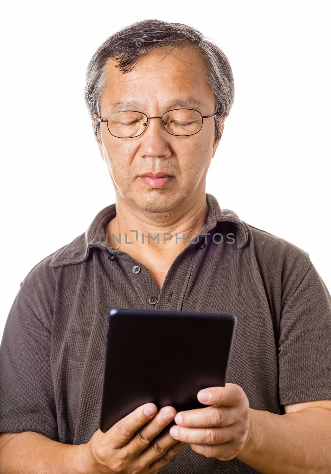 Asian man using tablet by leungchopan