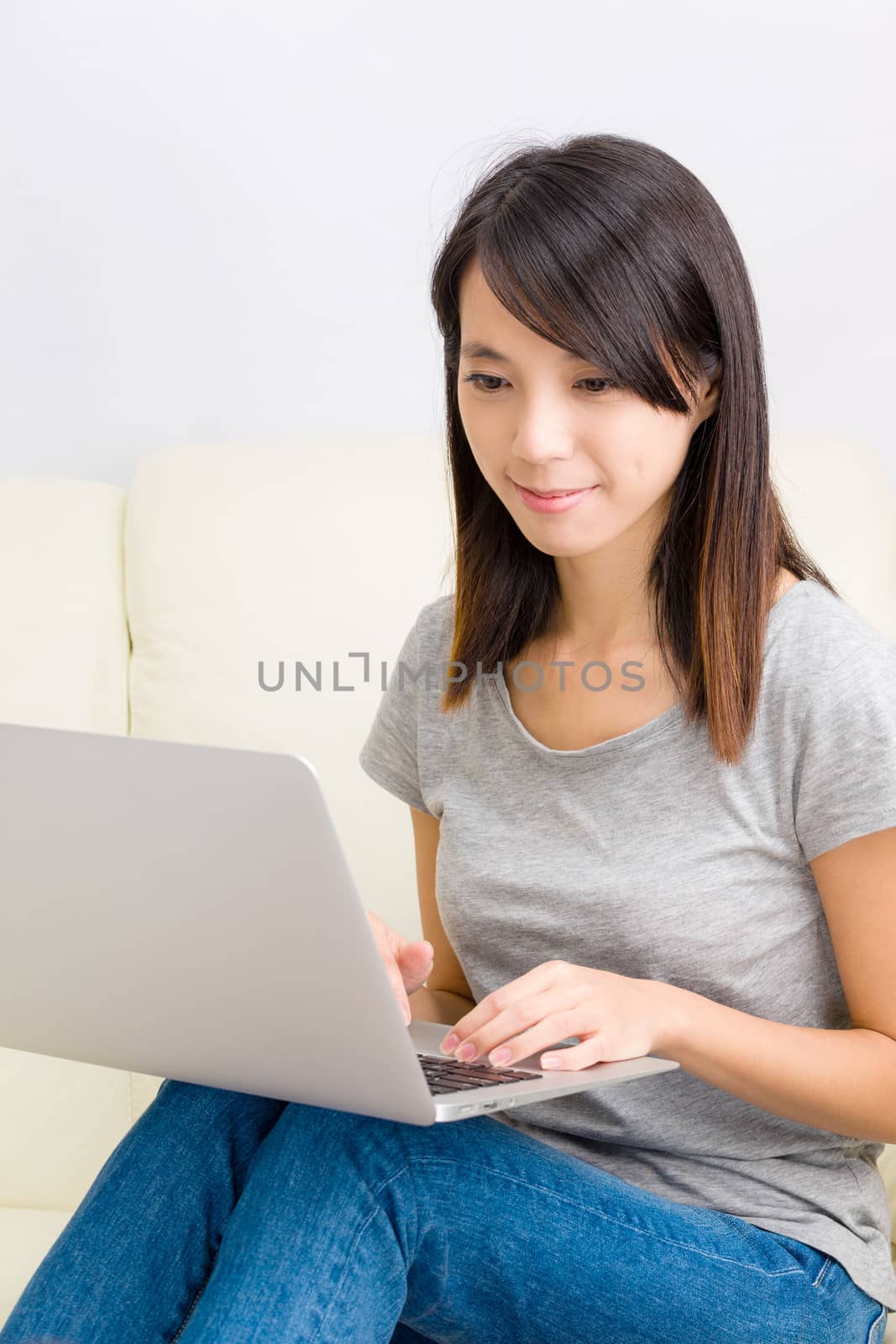 Asian woman using laptop