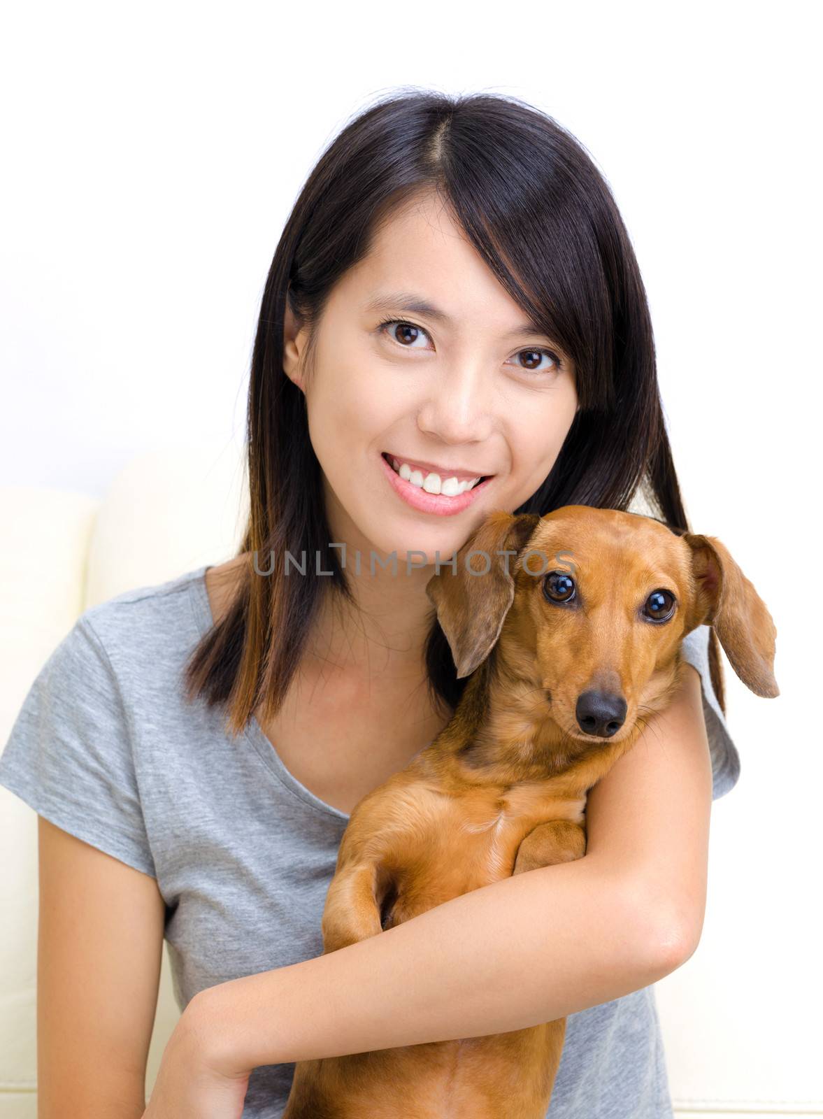 Asian woman with dachshund dog by leungchopan