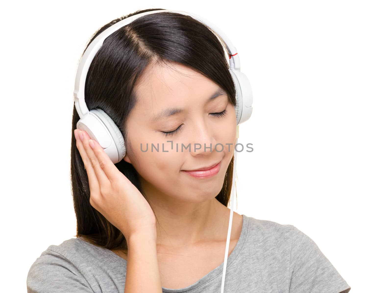 Asian woman listen to music by leungchopan