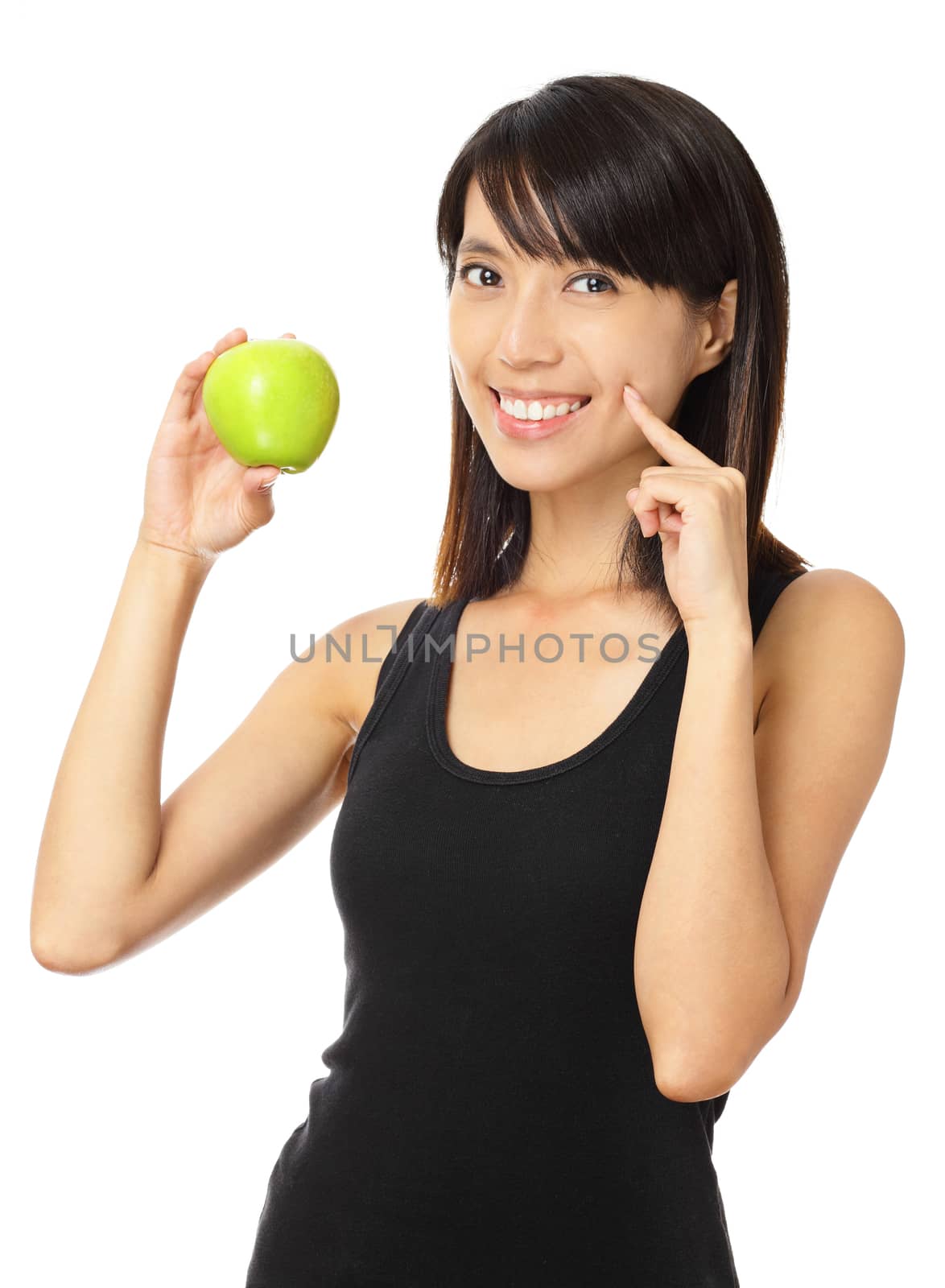Asian woman with green apple and toothy smile