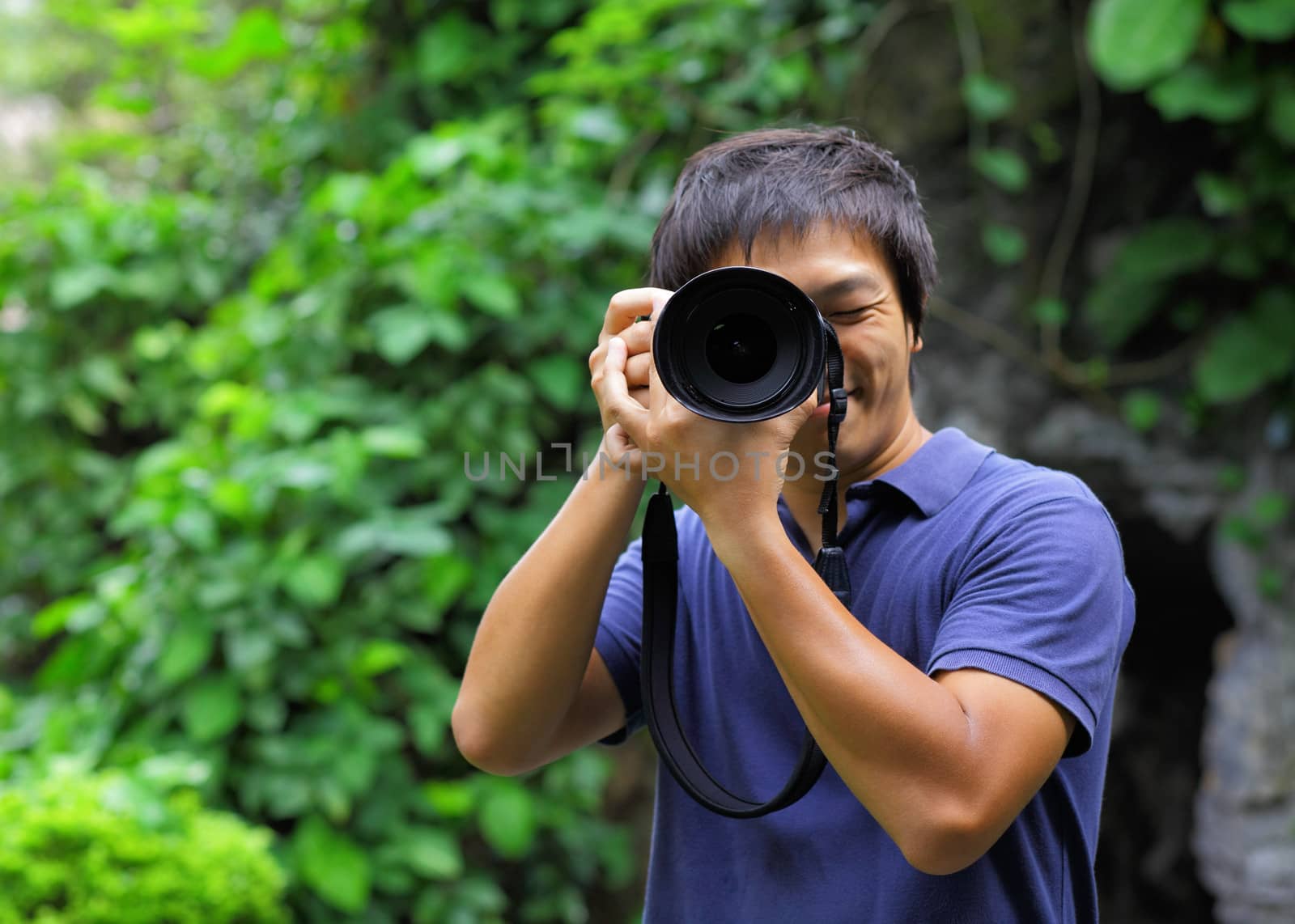 Asian man taking photo