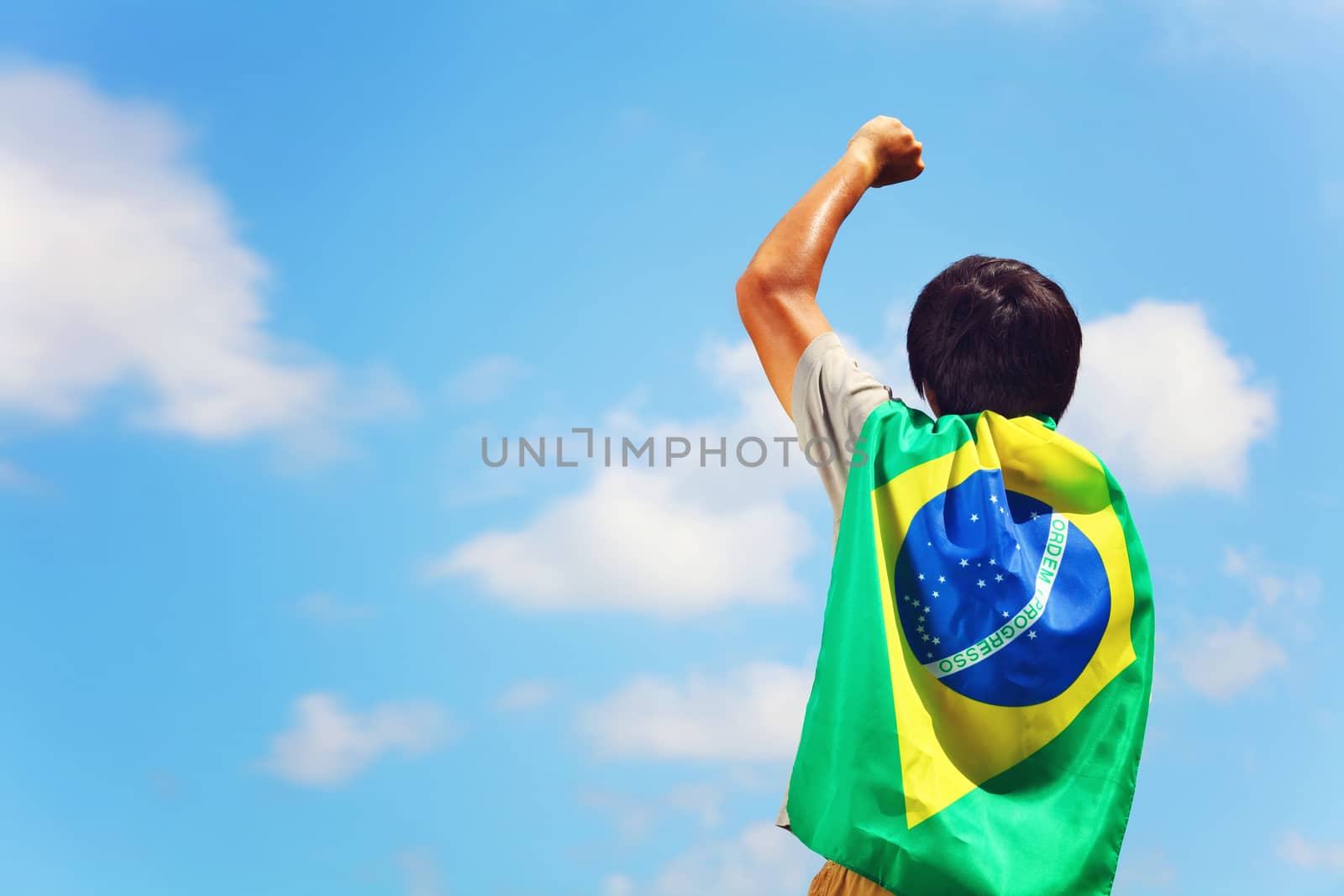 Excited man holding brazil flag by leungchopan