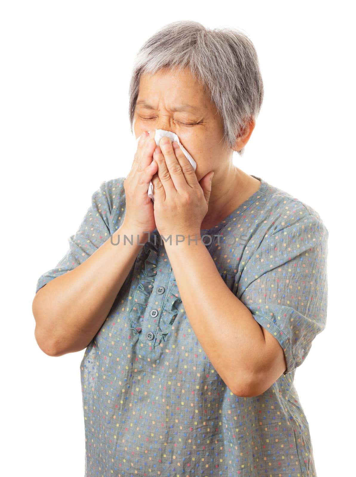 Sneezing asian elderly woman by leungchopan