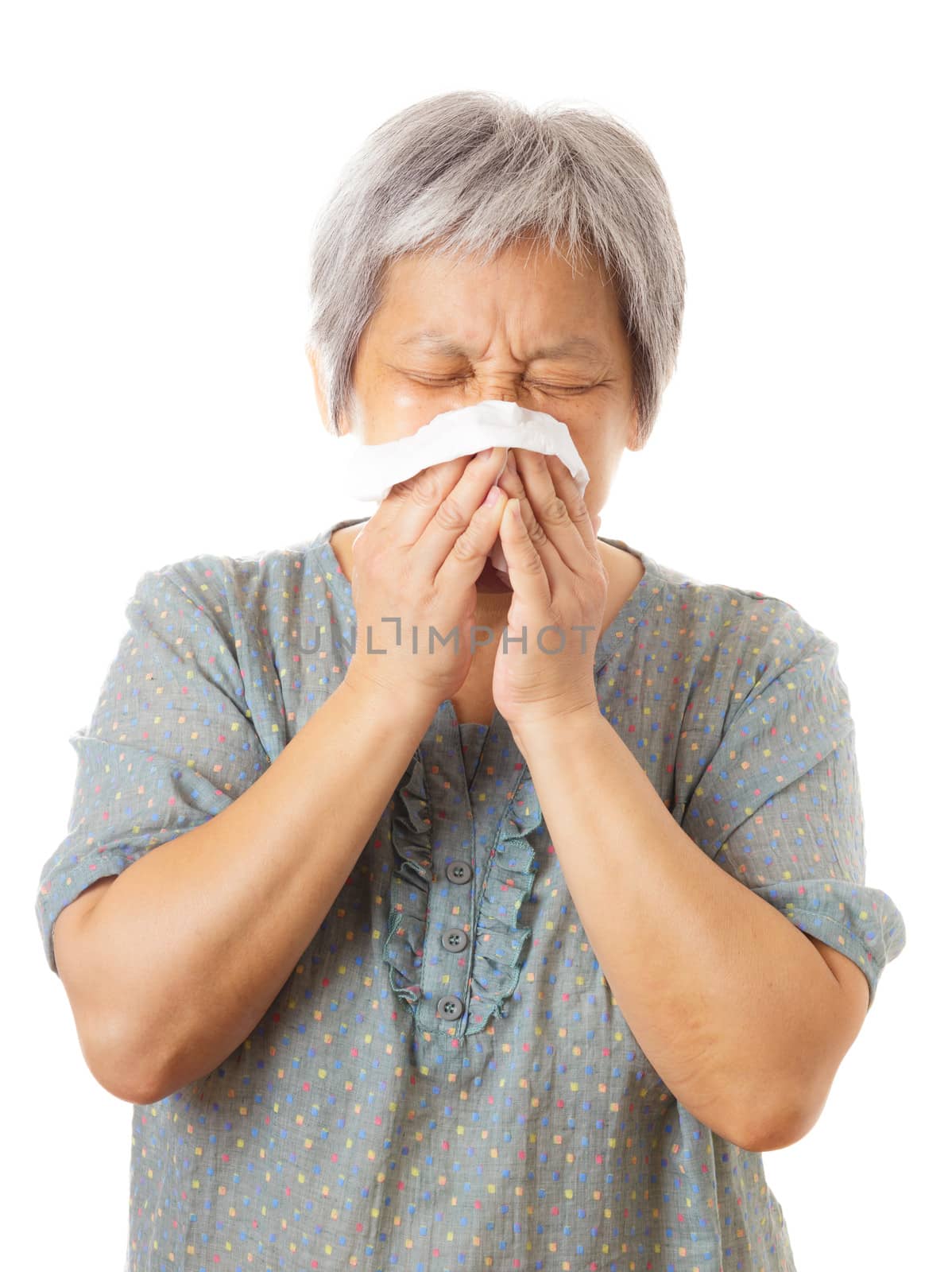Sneezing asian elderly woman