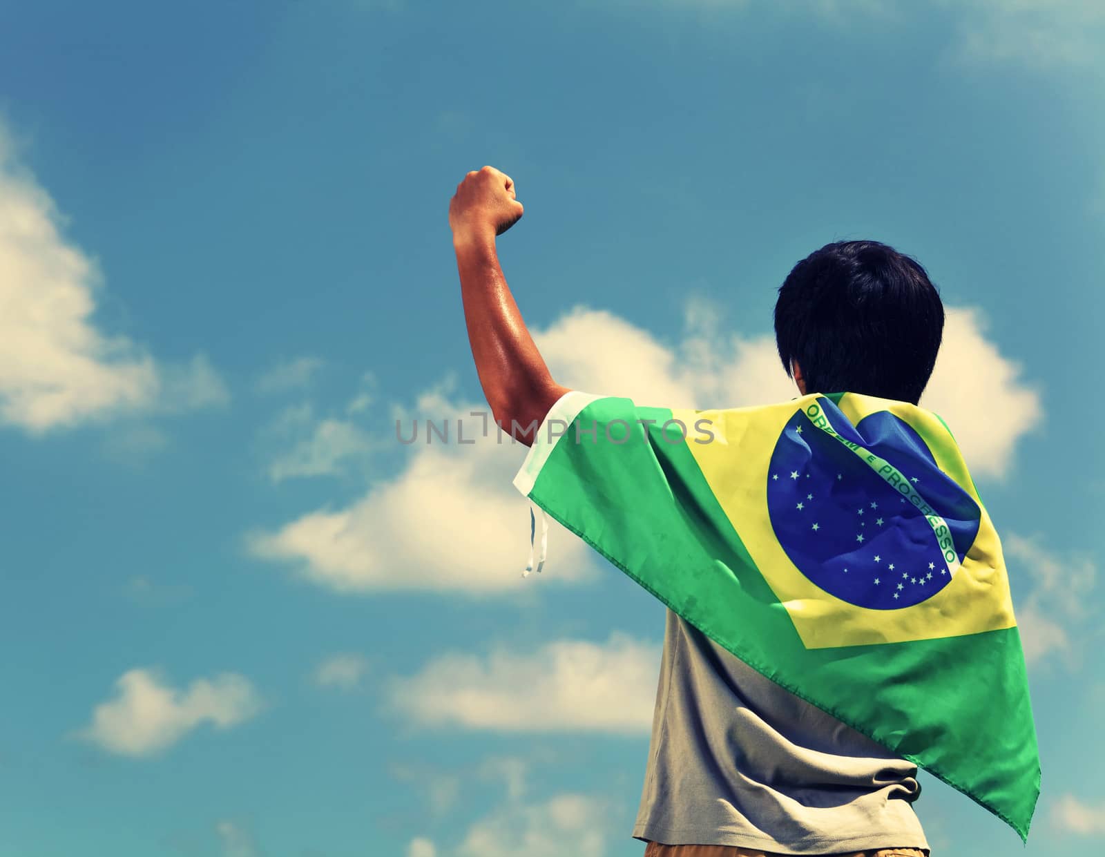 Excited man holding a brazil flag by leungchopan