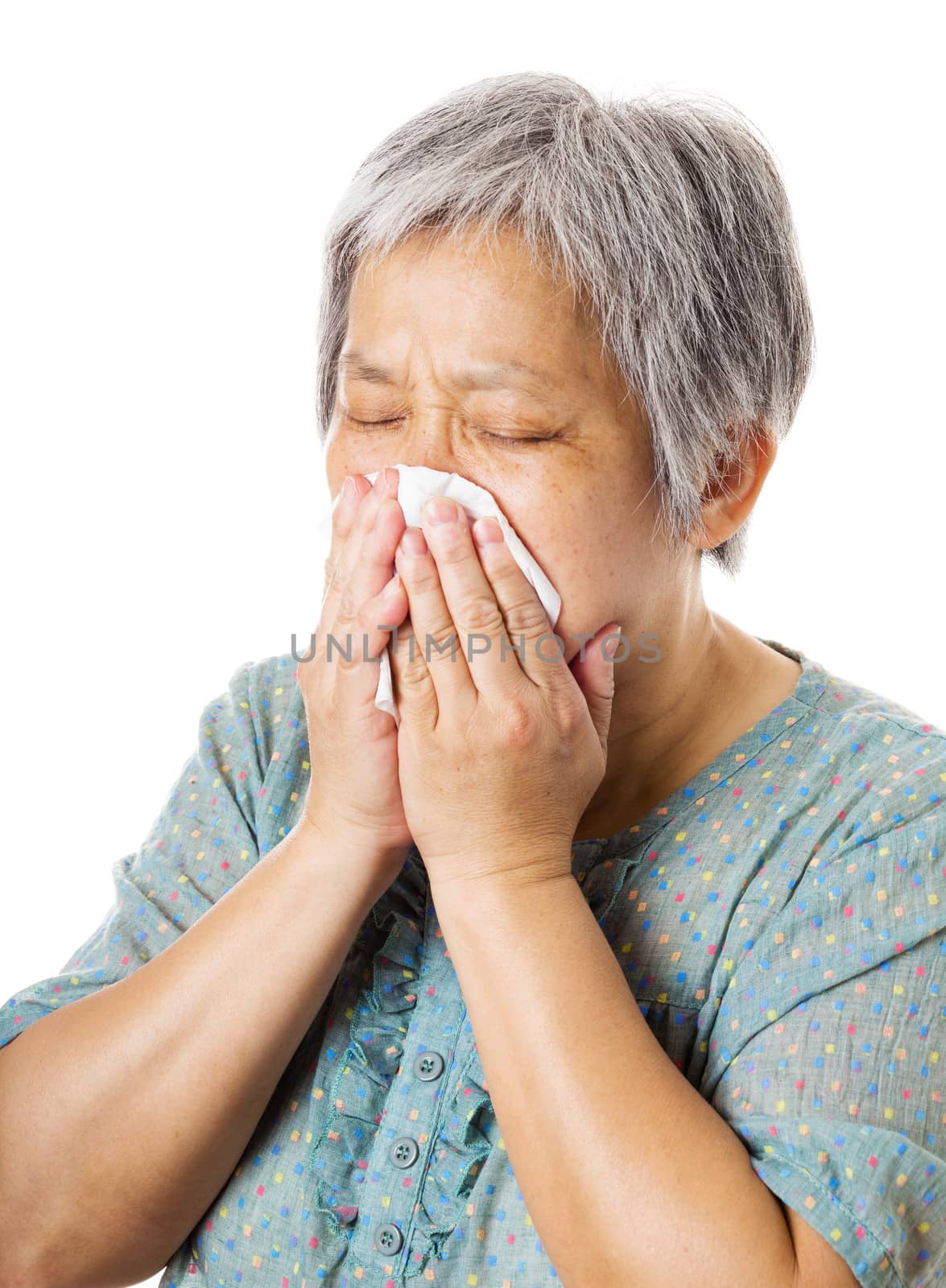 Sneezing mature asian woman