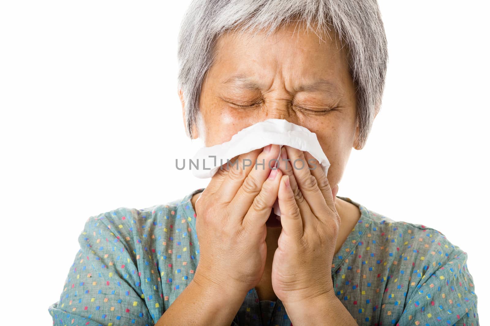 Asian old woman sneezing