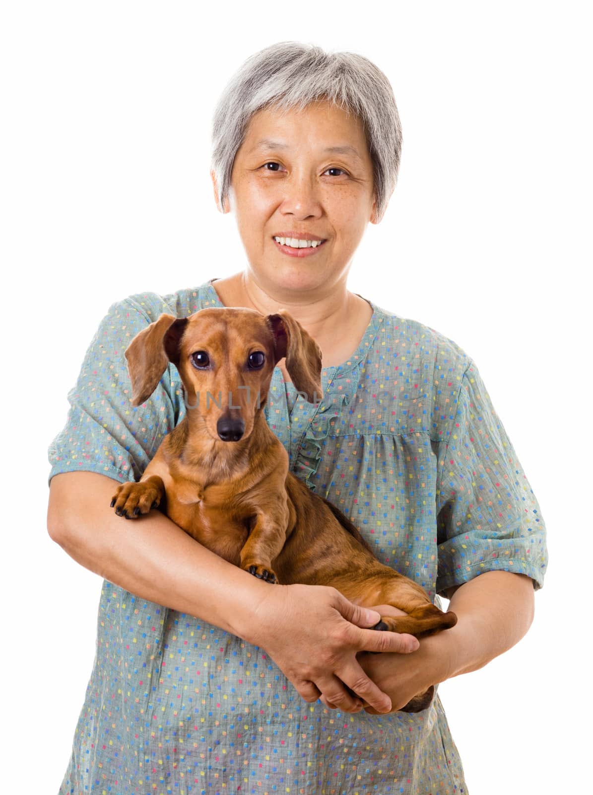 Mature asian woman with dachshund dog