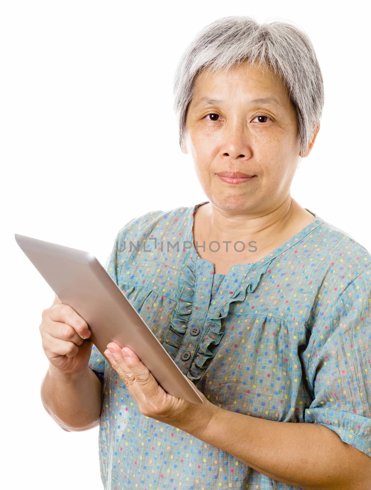 Asian old woman using tablet by leungchopan