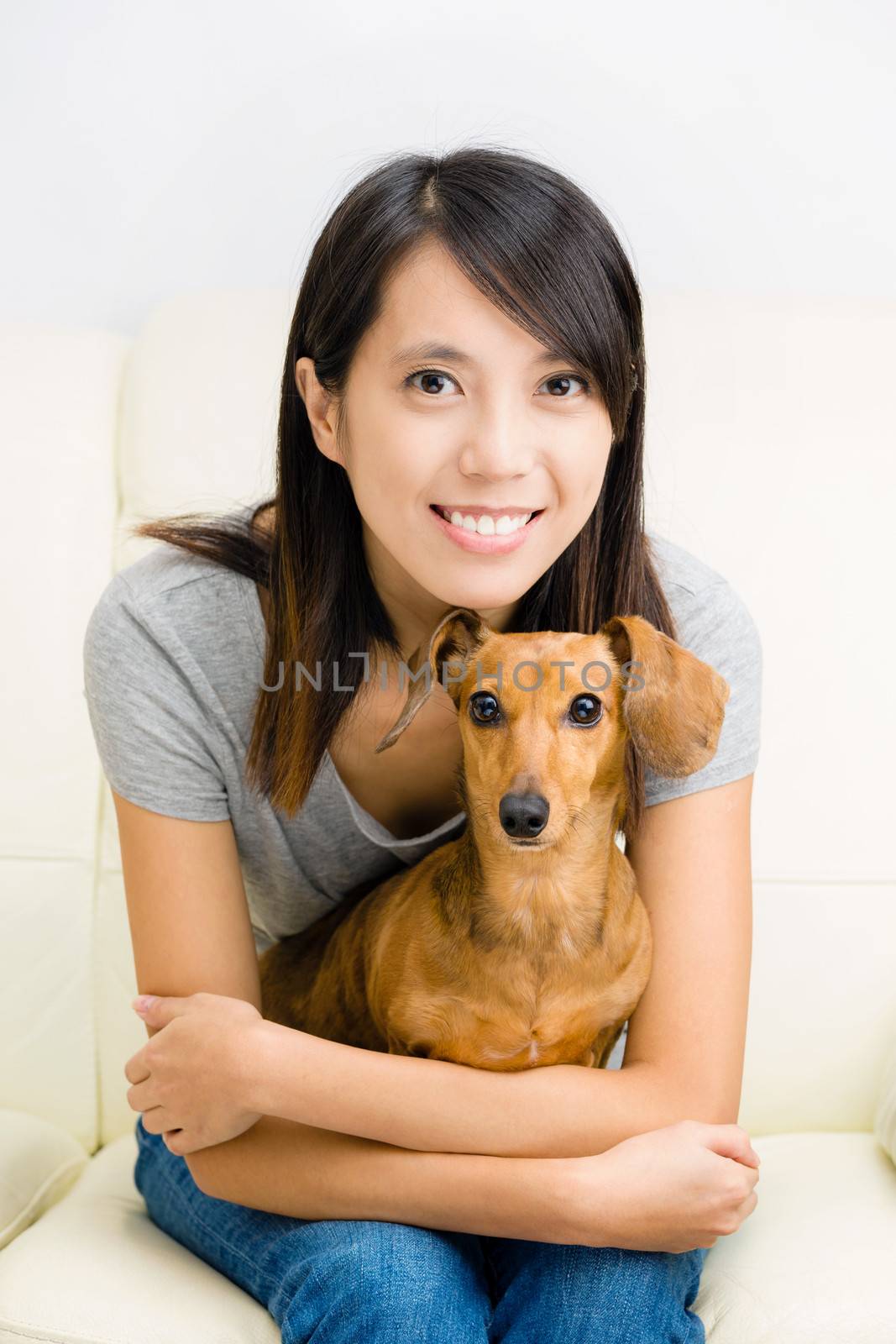 Asian woman and dachshund dog by leungchopan