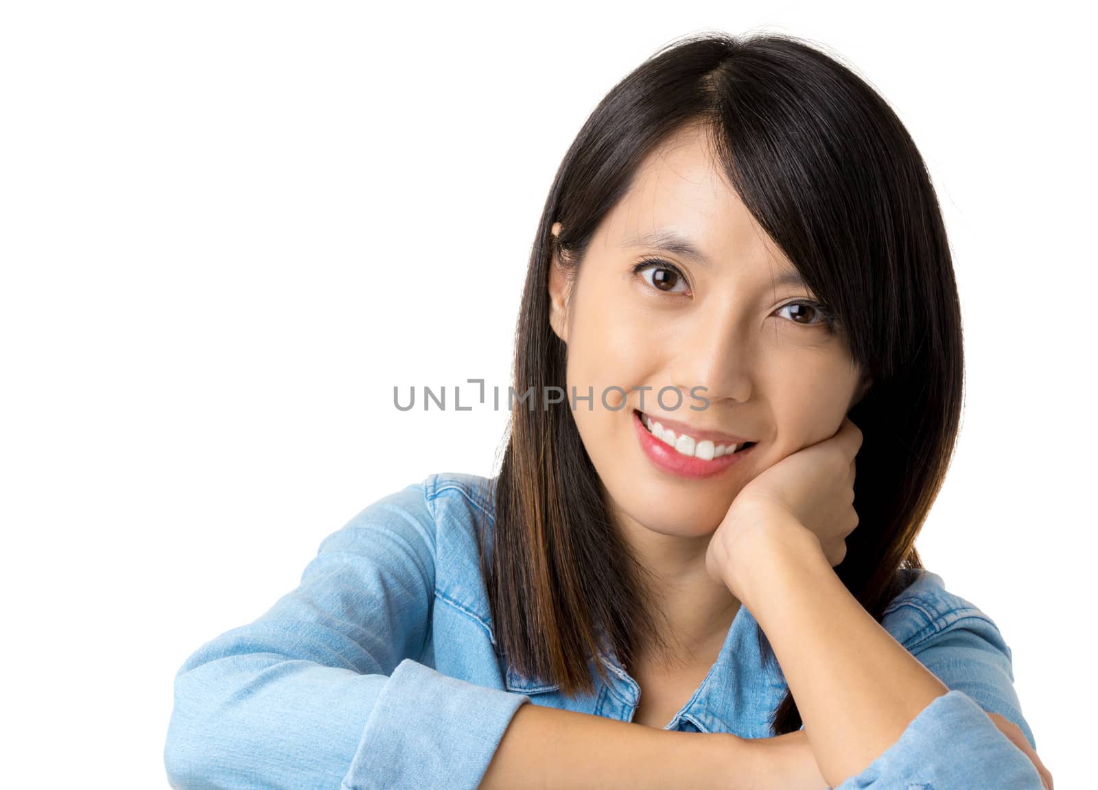 Asian woman with smile lying on table by leungchopan