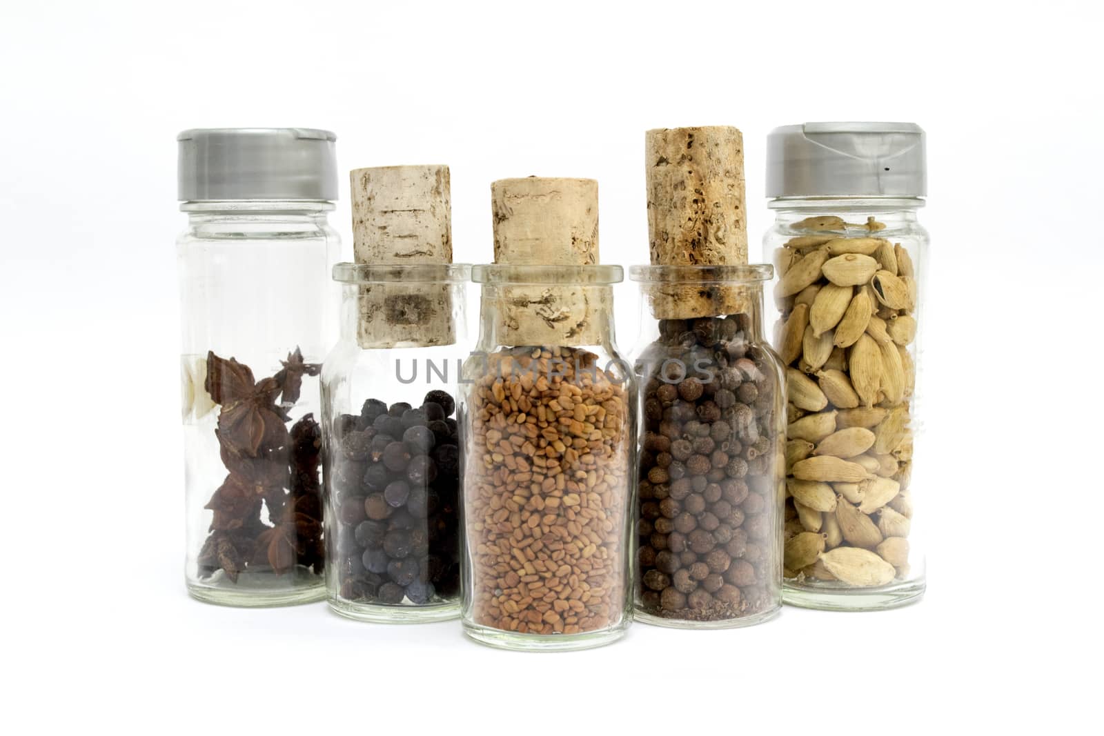 Glass container filled with spices and cork stopper