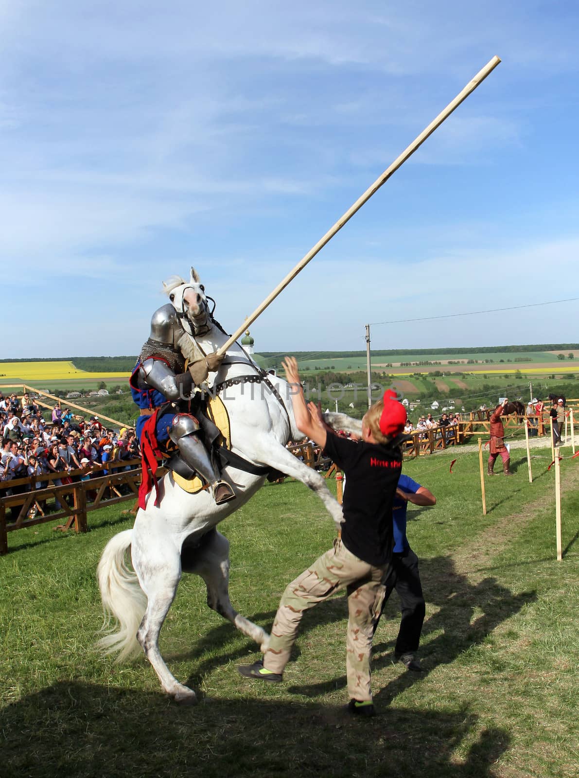 KHOTYN - MAY 10: Knight with lance riding a bucking horse during Festival Medieval Khotyn on May 10, Ukraine