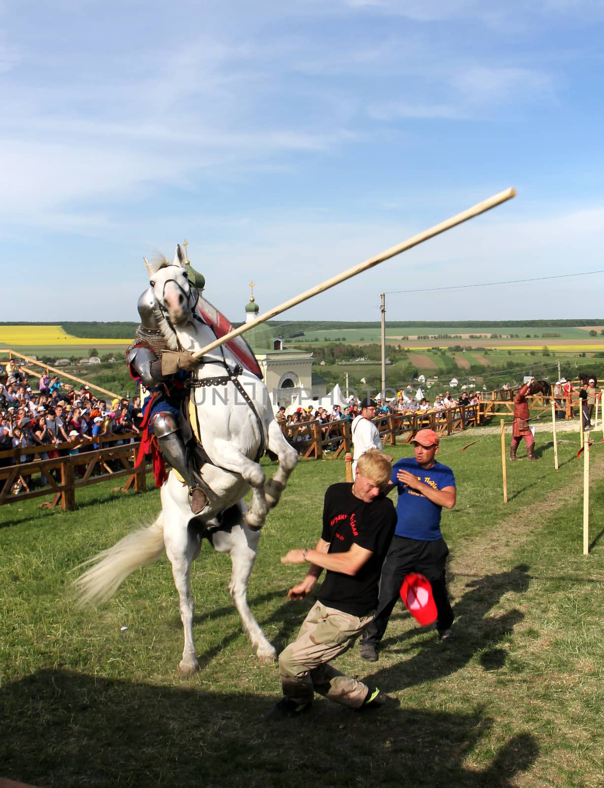 KHOTYN - MAY 10: Knight with lance riding a bucking horse during Festival Medieval Khotyn on May 10, Ukraine