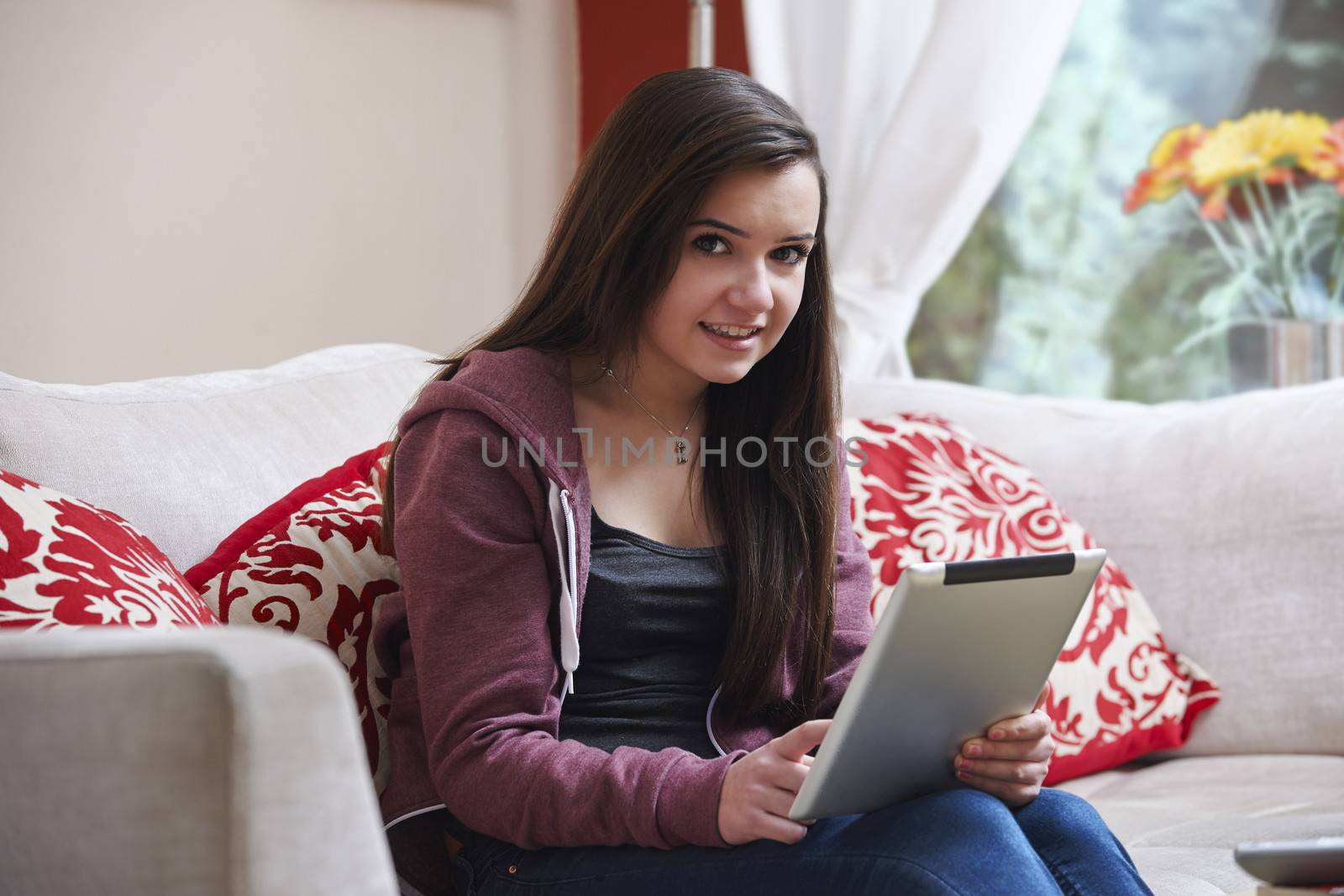 Teenage girl on tablet pc by gemphotography