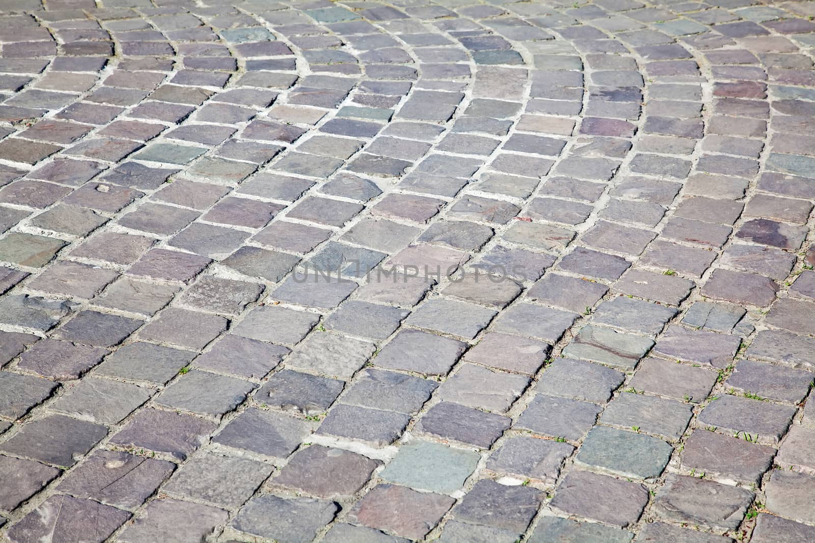 Grey cobblestone boulevard background texture